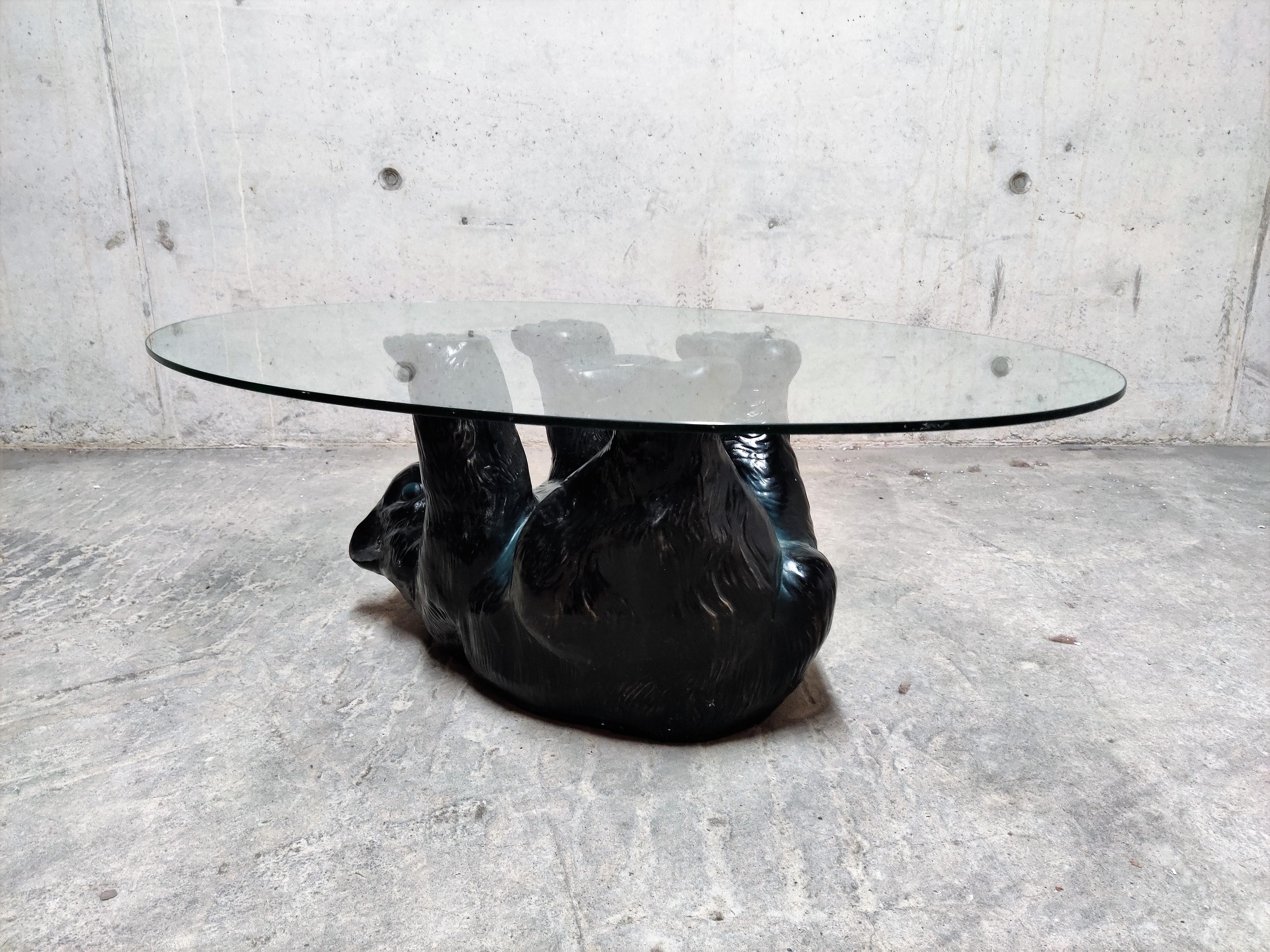 Eye-catching sculptural black bear coffee table.

This unique table looks great and somewhat cute.

It has an oval beveled glass top.

The table is in good condition.

1980s - Belgium

Dimensions:

Height 38cm/15”
Width