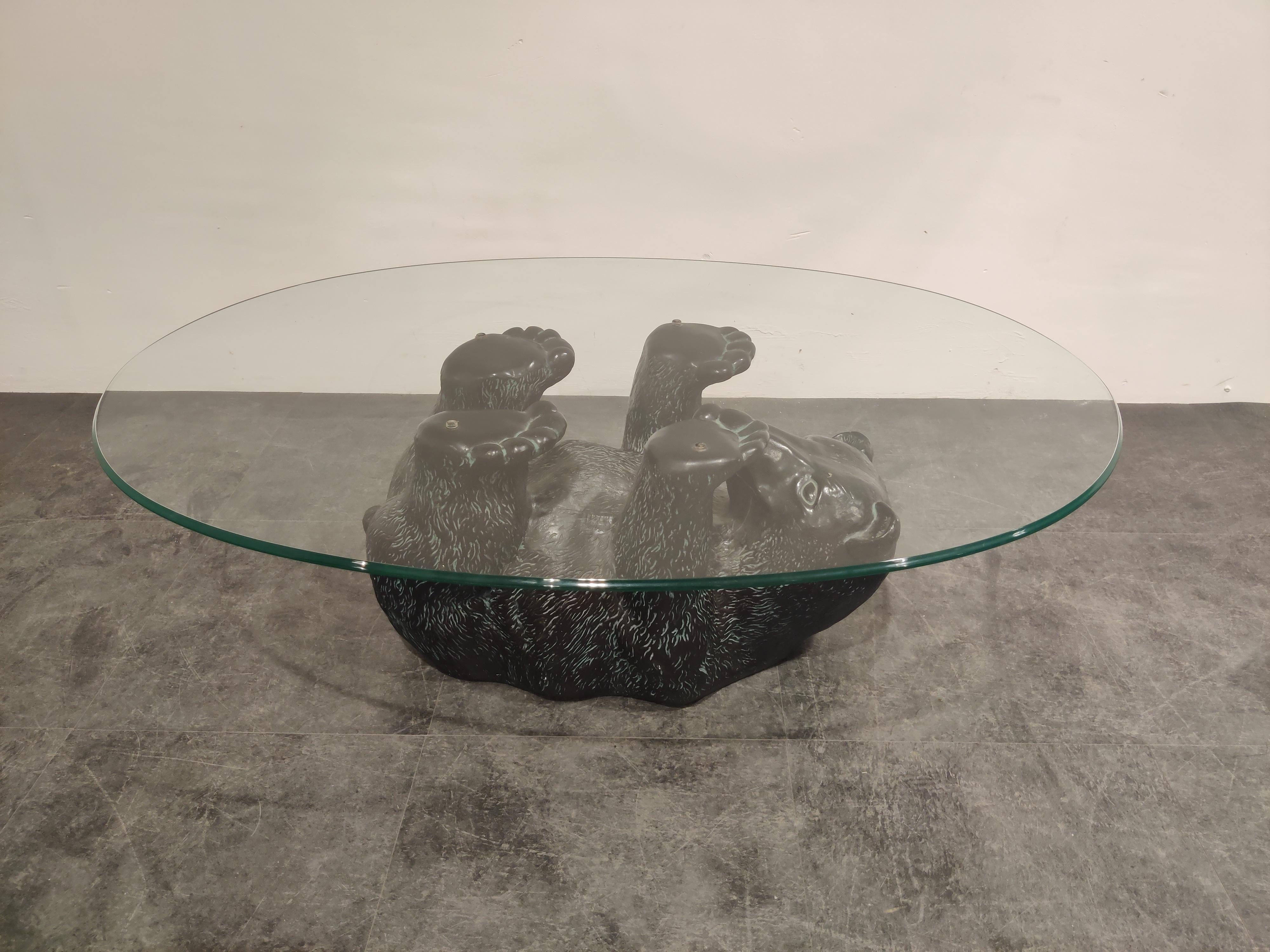 Eye-catching sculptural black bear coffee table.

This unique table looks great and somewhat cute.

It has an oval glass top, the base is made from plaster,

1970s, Belgium

Good condition

Dimensions:
Height 42cm/16.53