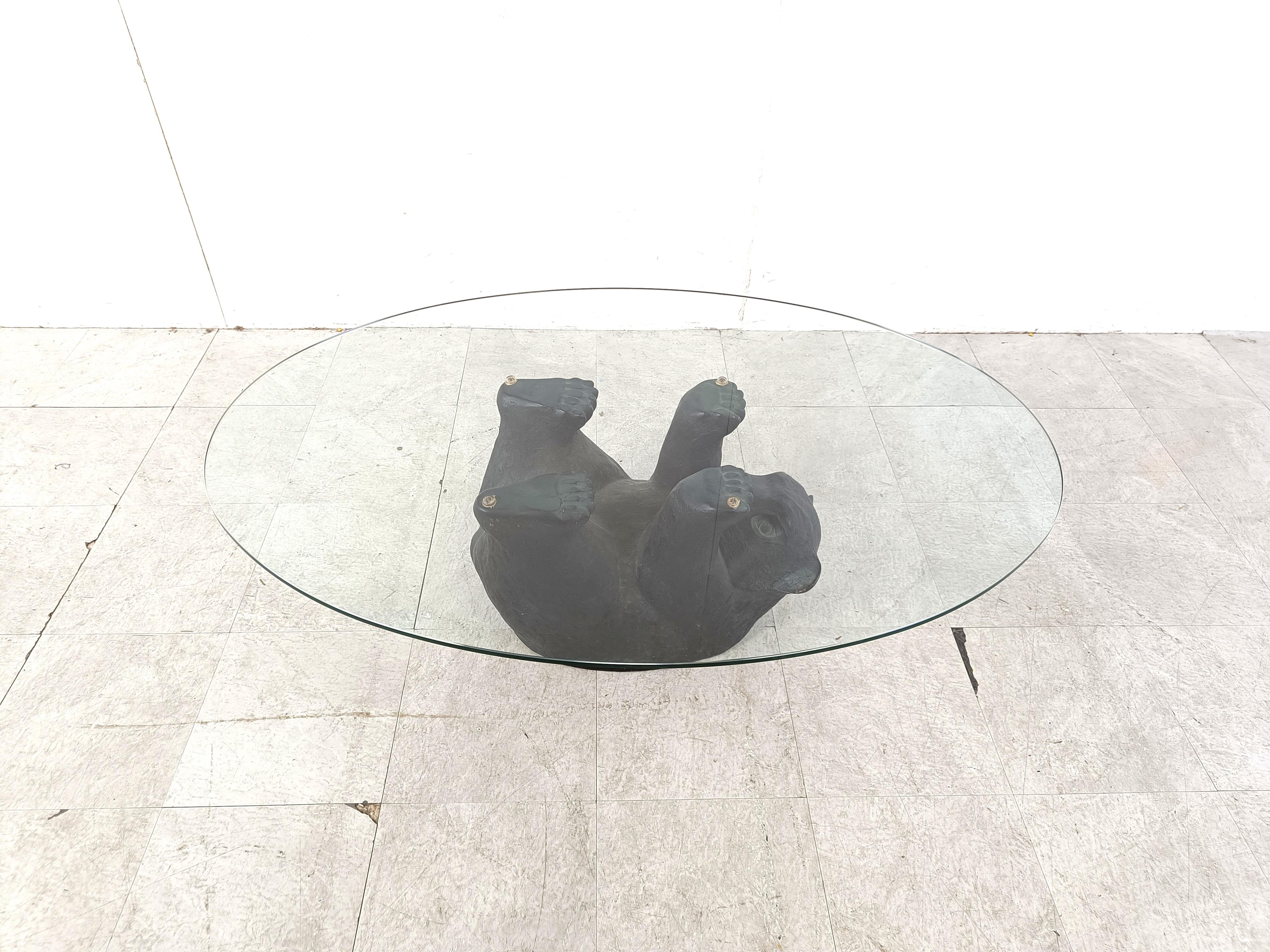 Eye-catching sculptural black bear coffee table.

This unique table looks great and somewhat cute.

1970s - Belgium

Good condition

Dimensions base:
Height: 40cm
Width: 110cm
Depth: 90cm

Ref.: 063877
