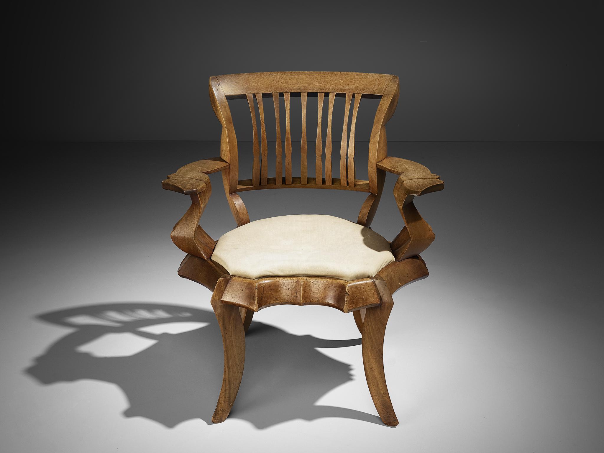 Armchair, solid mahogany, cream fabric upholstery, the Netherlands, 1927

Unique armchair in mahogany with a seating in cream colored fabric upholstery. This one-off chair was designed by a student of the Instituut voor Kunstnijverheidsonderwijs