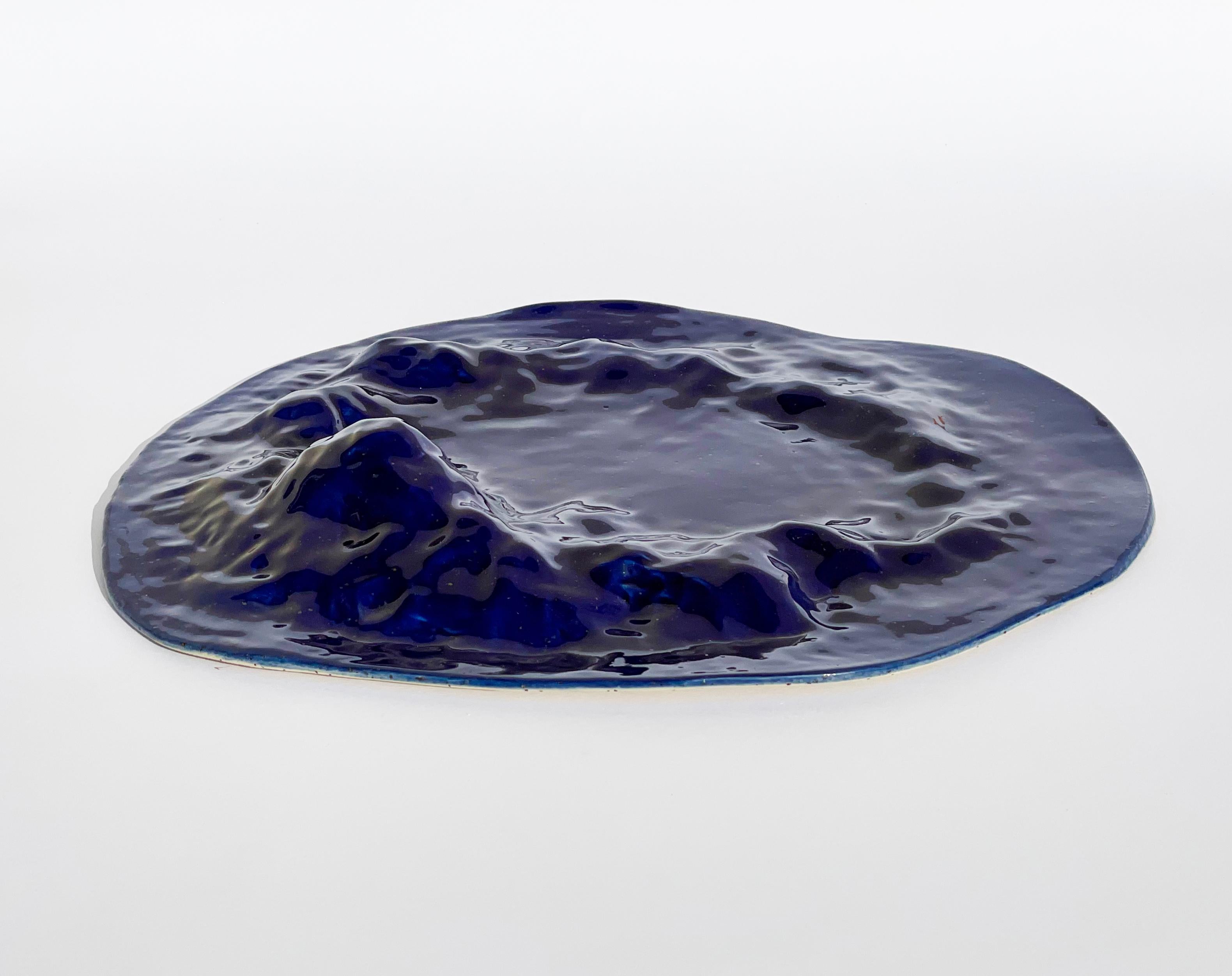 Gongshi plates

Hand made Unique Undulating Form Plates, Objet d'Art in cobalt blue.

These sculptural plates are taking inspiration from the Chinese ‘gongshi’
‘Gongshi (Chinese: ??), also known as scholar's rocks, are naturally occurring or