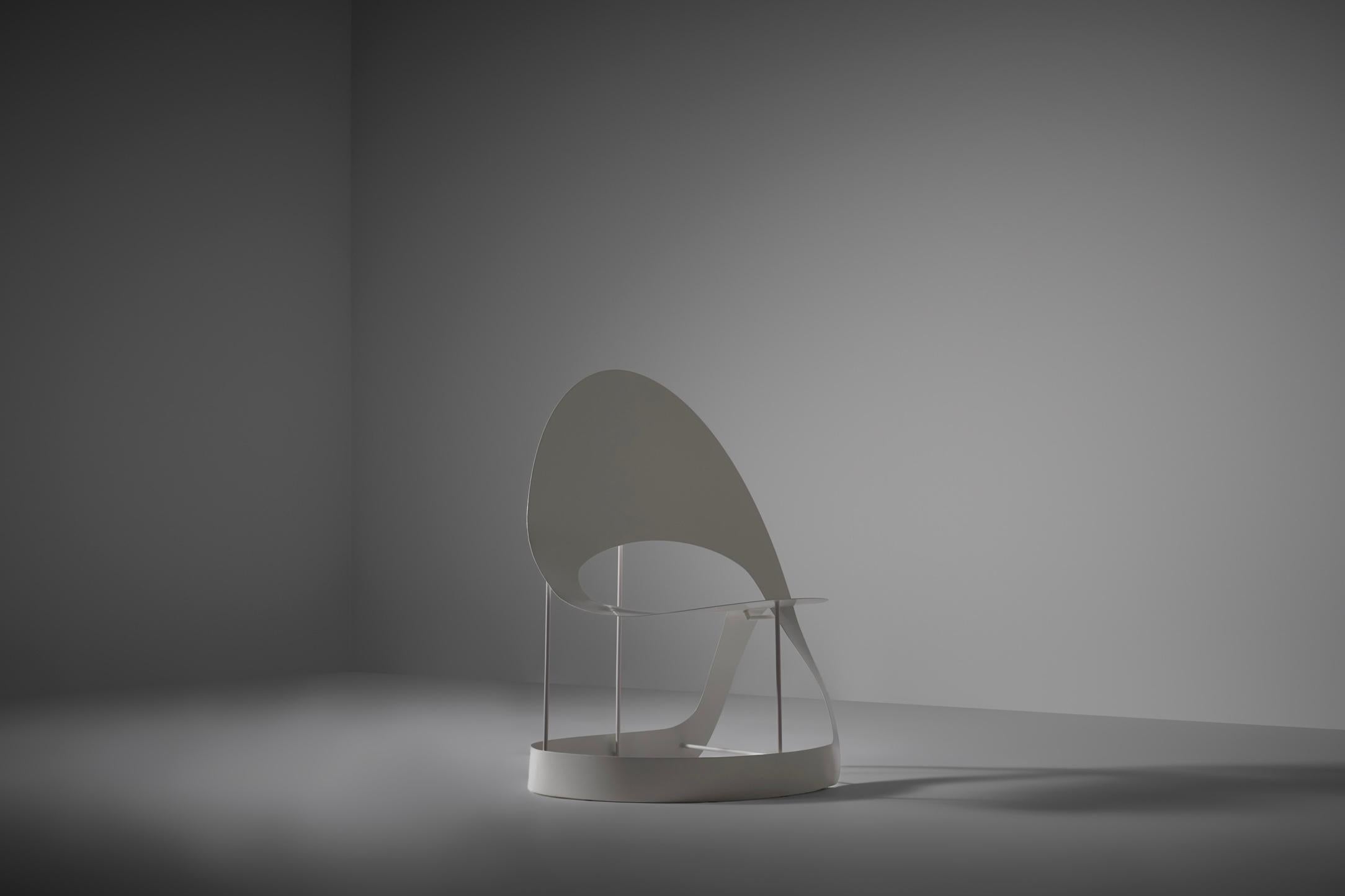 Unique sculptural metal chair, France 1960s. Beautiful aerodynamic flowing shapes resulting in an outstanding sculptural object. The surface of the chair shows a nice thick and voluminous lacquered finish, achieved over the years. Interesting play