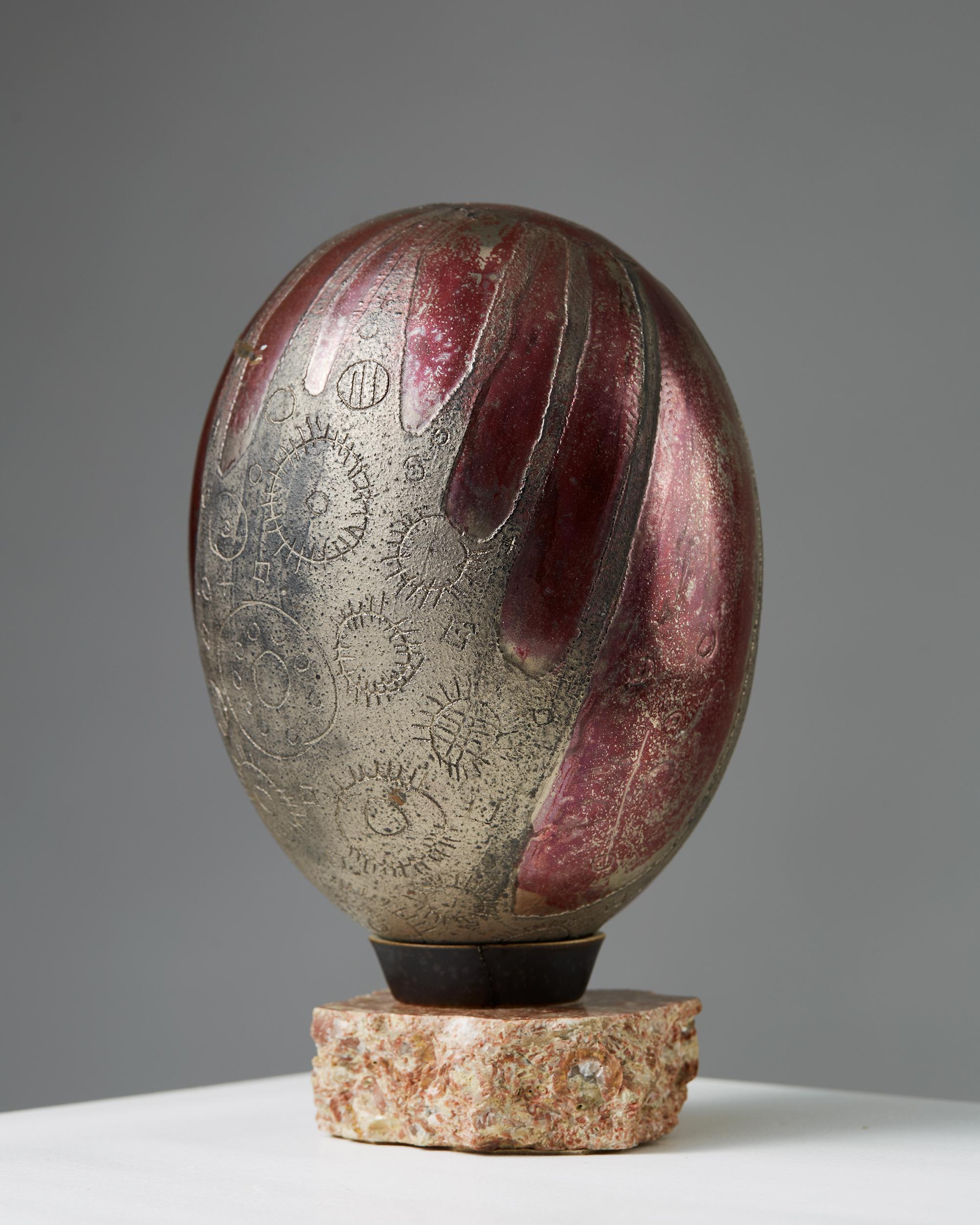 Unique Sculpture, made by Toini Muona,
Finland. 1960s/Early 1970s

Stoneware with a metallic glaze. Support of limestone and porcelain.

Measurements:
H: 21 cm/ 8 1/4