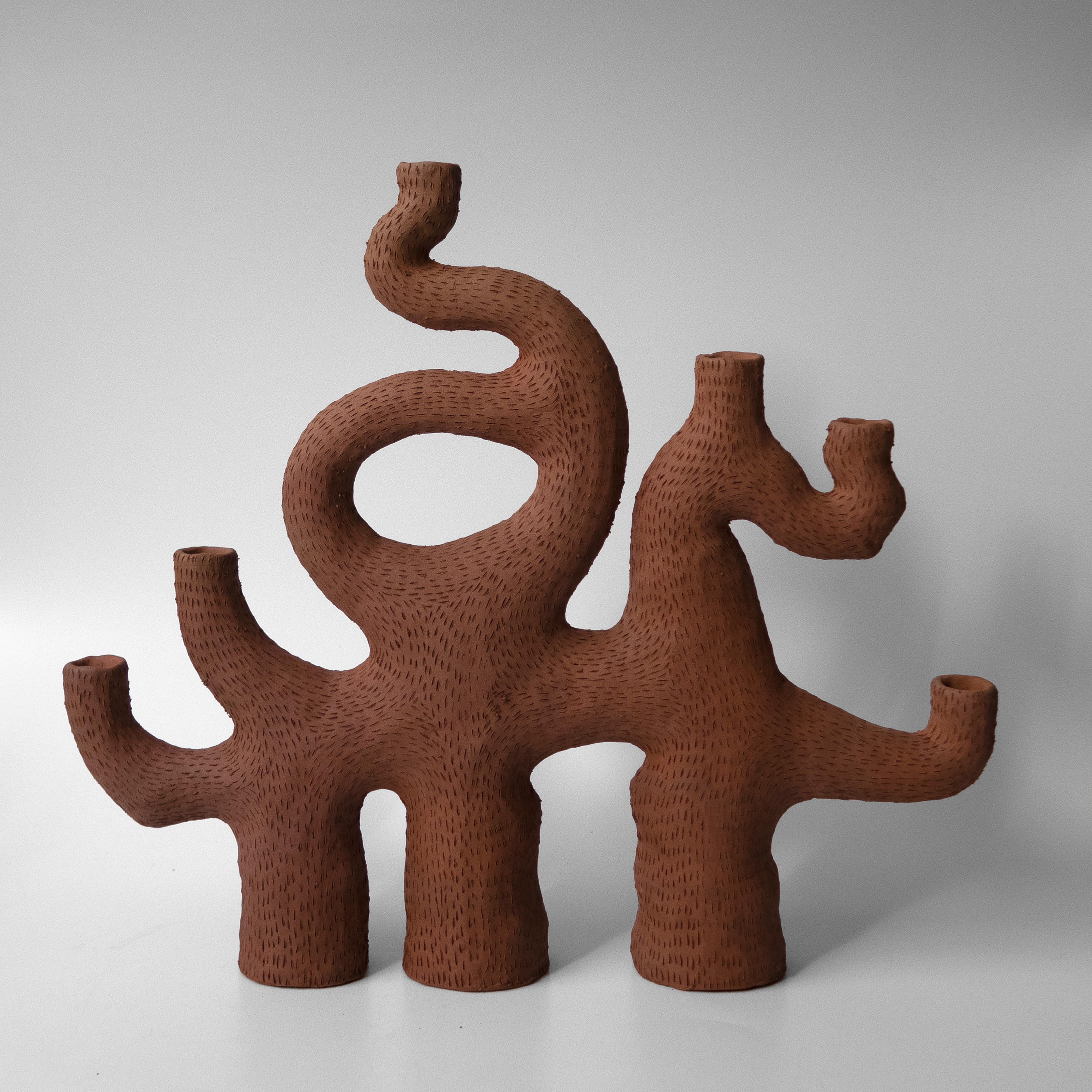 Unique sea candelabra by Jan Ernst
Dimensions: W 45 D 12.5 H 48 cm
Materials: Terracotta, stoneware, black clay

Glazed to client specification
Other dimensions available
6 arms 3 legs.

The work is influenced by his fascination with natural