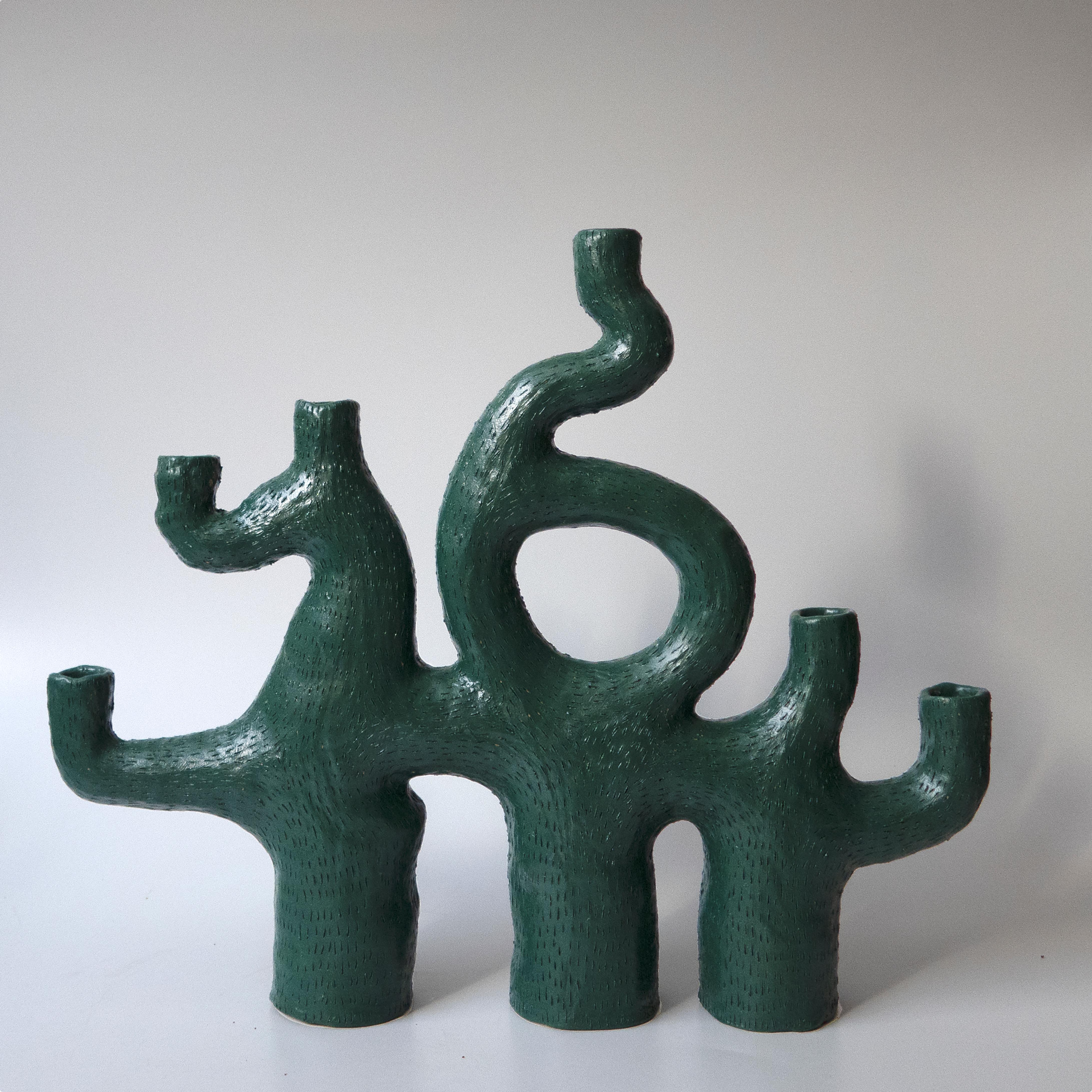 Unique sea candelabra by Jan Ernst
Dimensions: W 45 D 12.5 H 48 cm
Materials: Terracotta, stoneware, black clay
.
Glazed to client specification.
Other dimensions available
6 Arms 3 Legs.

The work is influenced by his fascination with