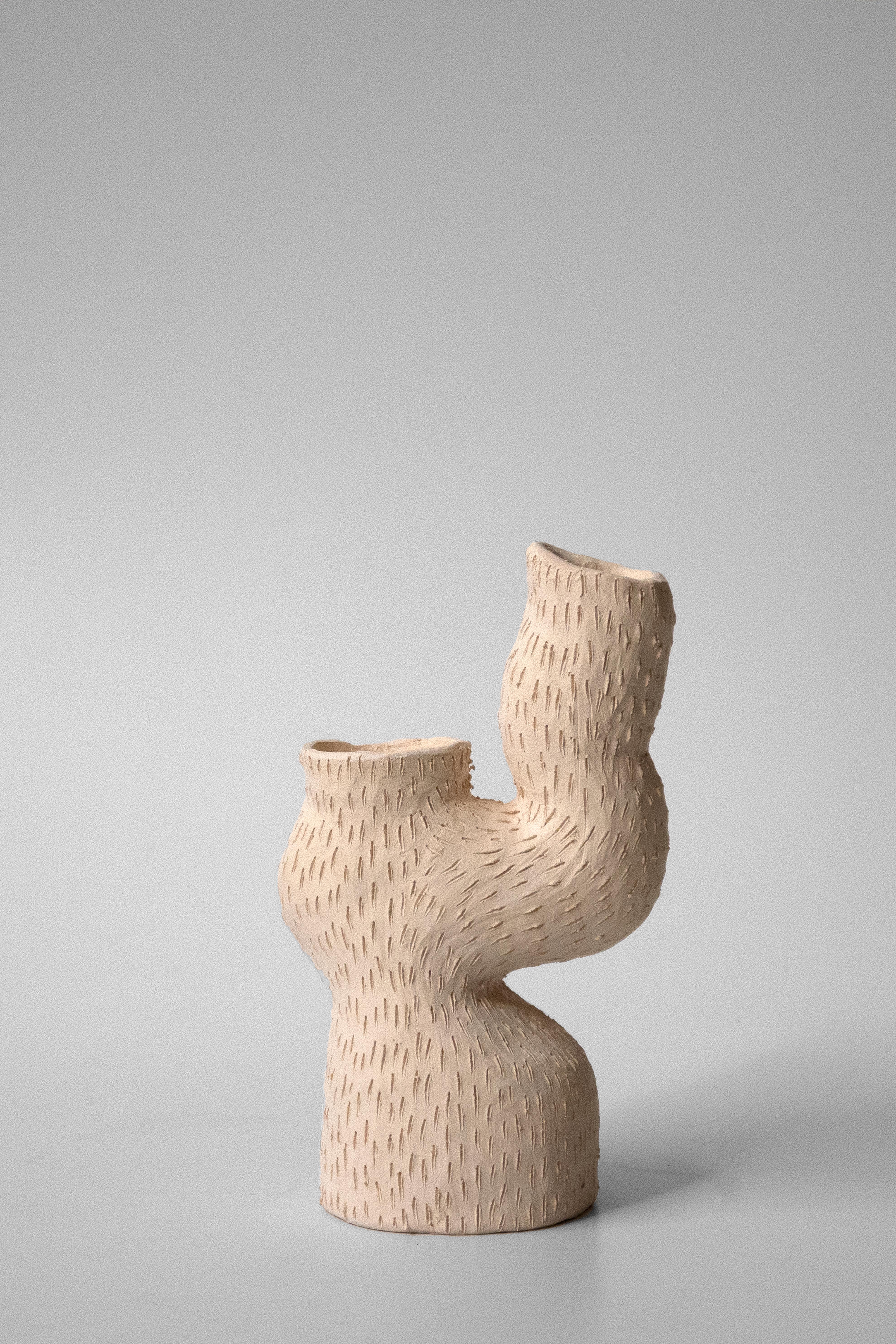 Sea candelabra by Jan Ernst
Dimensions: W 15 D 8 H 20 cm
Materials: Terracotta, stoneware, black clay

Glazed to client specification.
Other Dimensions Available
1 leg 1 arm.

The work is influenced by his fascination with natural structures