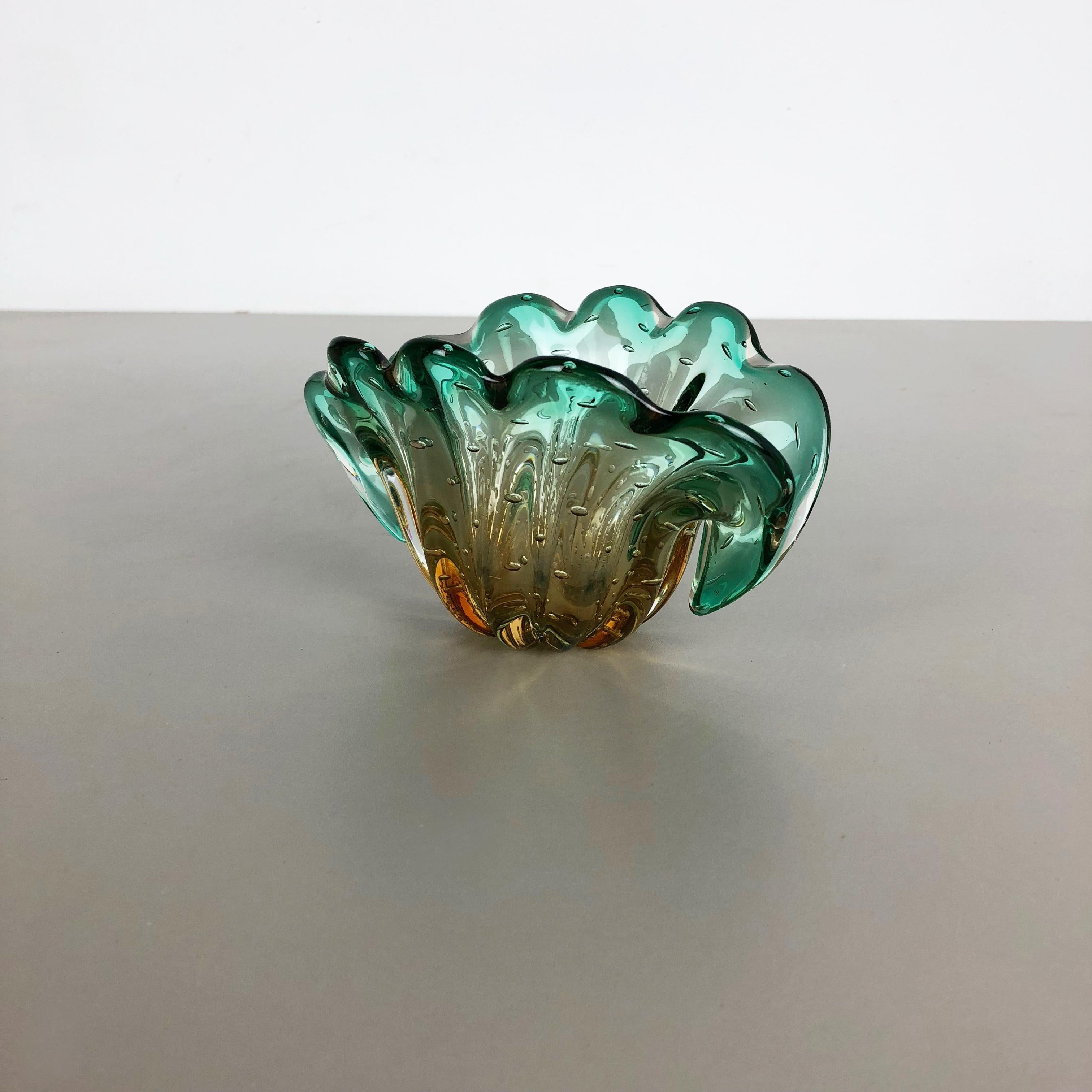 Article:

Murano glass shell element

Origin:

Murano, Italy

Decade:

1970s

An elegant green brown Murano glass bowl utilizing the bullicante technique of controlled bubbles within the glass. The element combine the color of green on