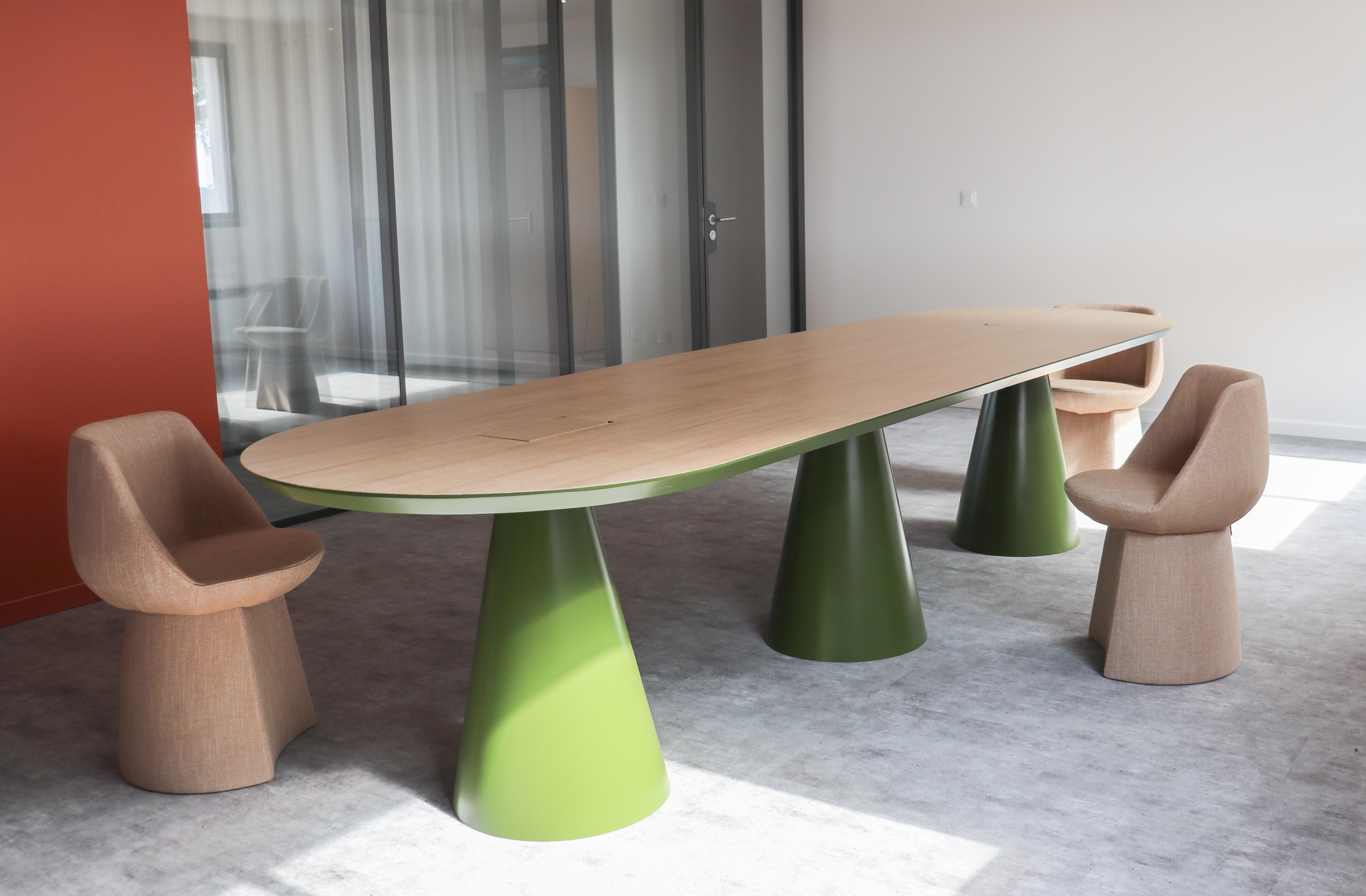 Unique Senventies Meeting Table Signed by Gigi Design
Dimensions: D350 x W100 x H74 cm
Materials: Olive green lacquer, natural oak veneer top

Hidden HDMI, USB jacks.
A desire for retro and to dive into the furniture of the 70s.
The three legs and