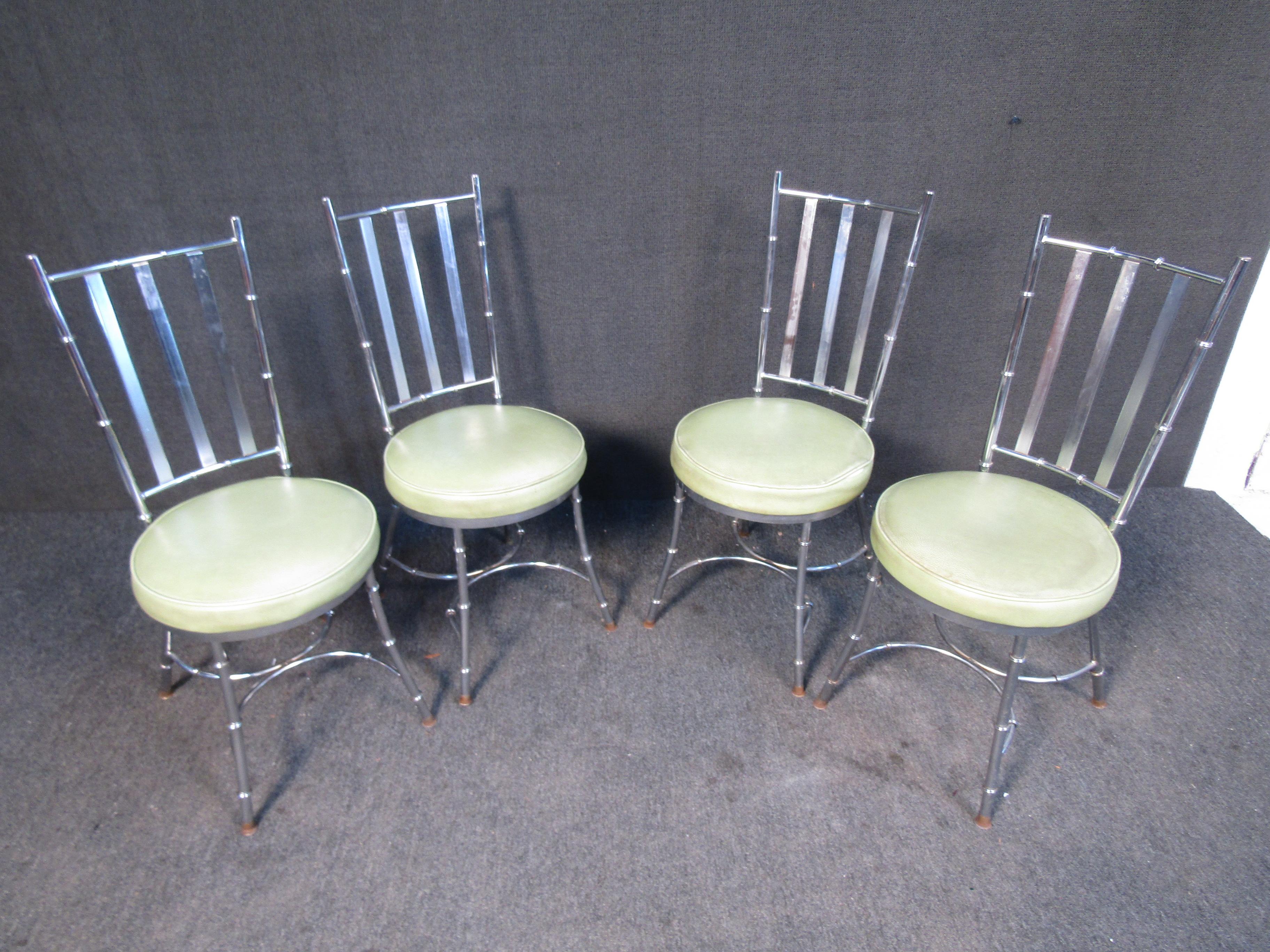 This set of four vintage dining chairs have an attractive chrome frame that is complemented by light green upholstered cushions. Please confirm item location with seller (NY/NJ).