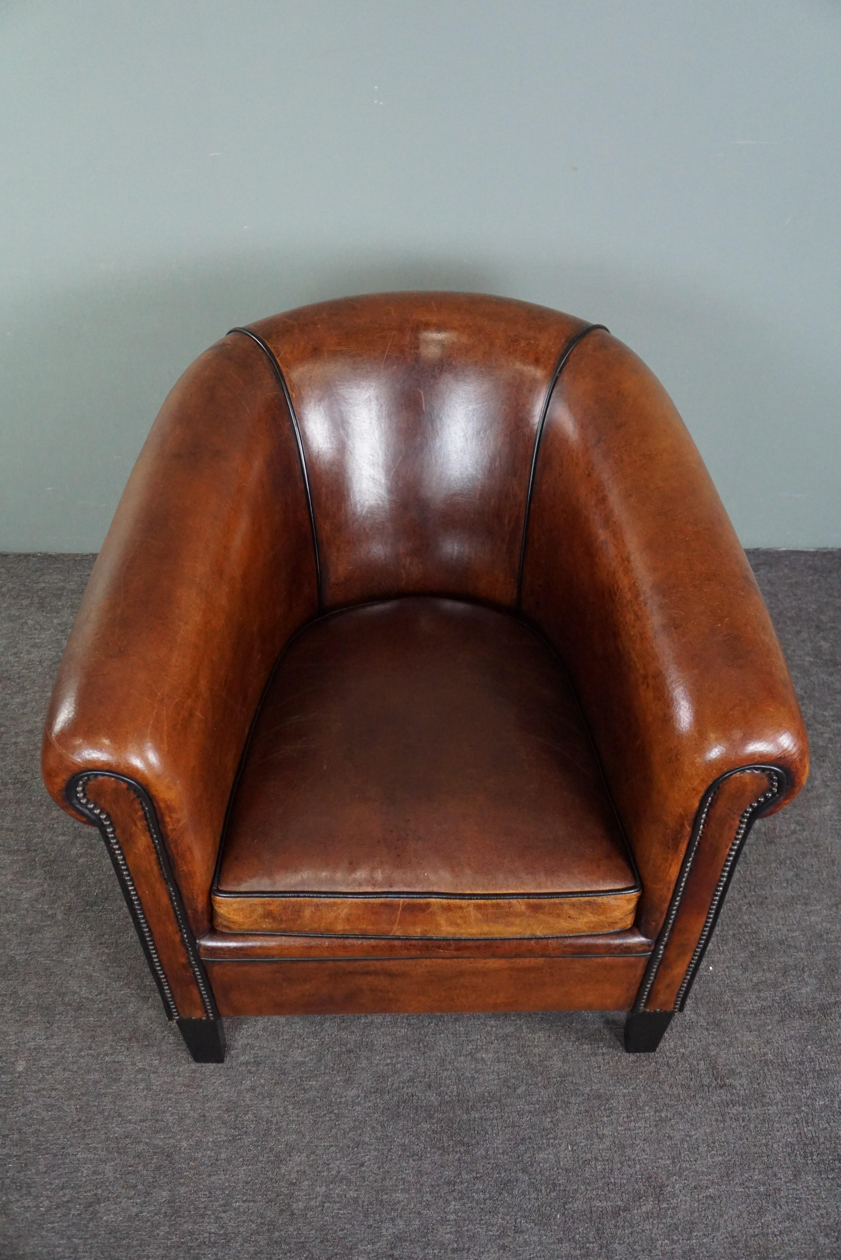 Contemporary Unique sheep leather club chair with black piping and decorative nails For Sale