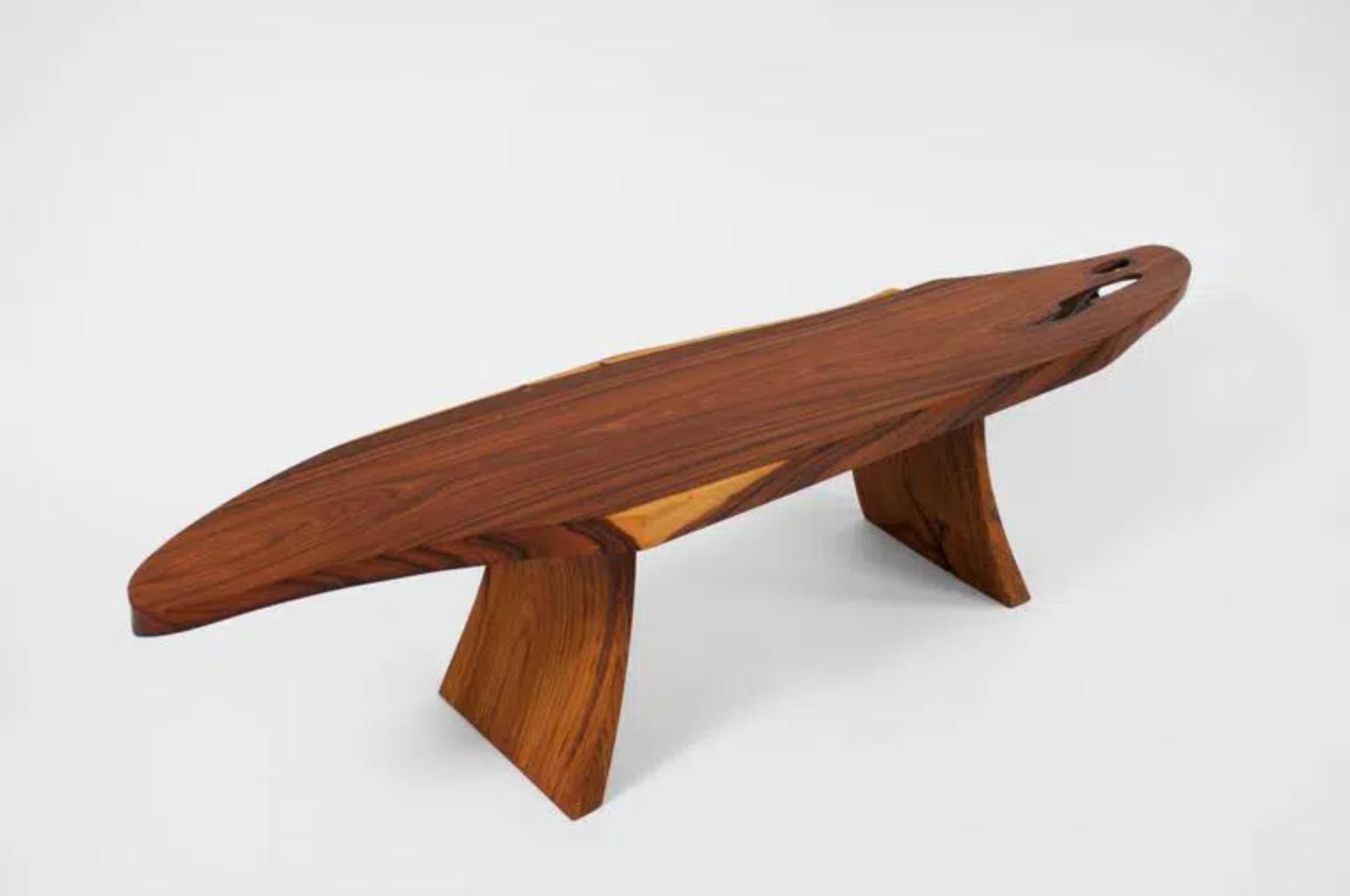 Unique signed table by Jörg Pietschmann
Table, Santos Palisander, teak, T1305
Measures: H 37.5 x W 160 x D 35 cm tabletop 4.5 cm
Extremely elegant tabletop of rosewood (Santos palisander),
the curved legs are carved out from a block of teakwood and