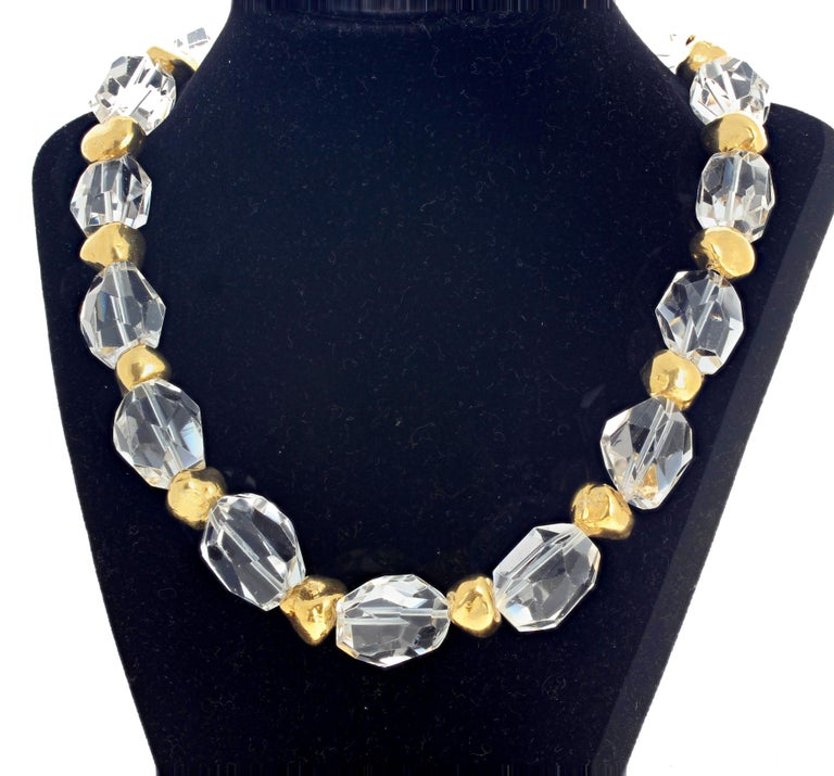 Highly glowing checkerboard gem cut and polished unique chunks of silvery white natural Brazilian Quartz accented with goldy coated nuggets in this beautiful unique 17 inch long necklace with easy to use hook clasp.  The largest Quartz gemstone is