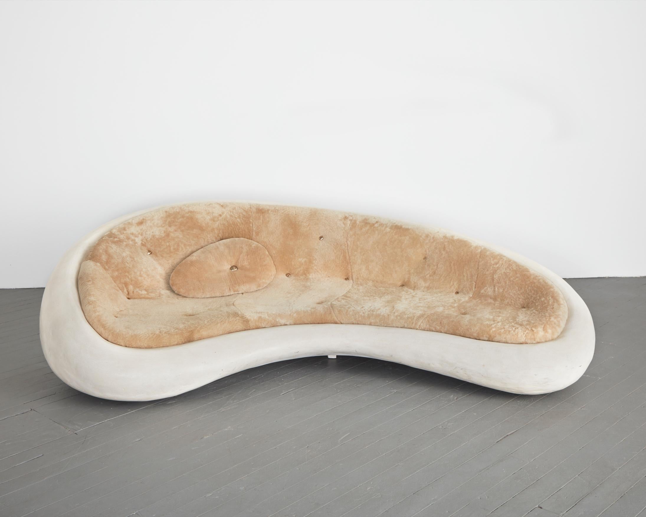 Available for custom commission. Unique sofa in marble composite with upholstered shearling seating and bronze sculptural buttons. Designed and made by Rogan Gregory, USA, 2019.