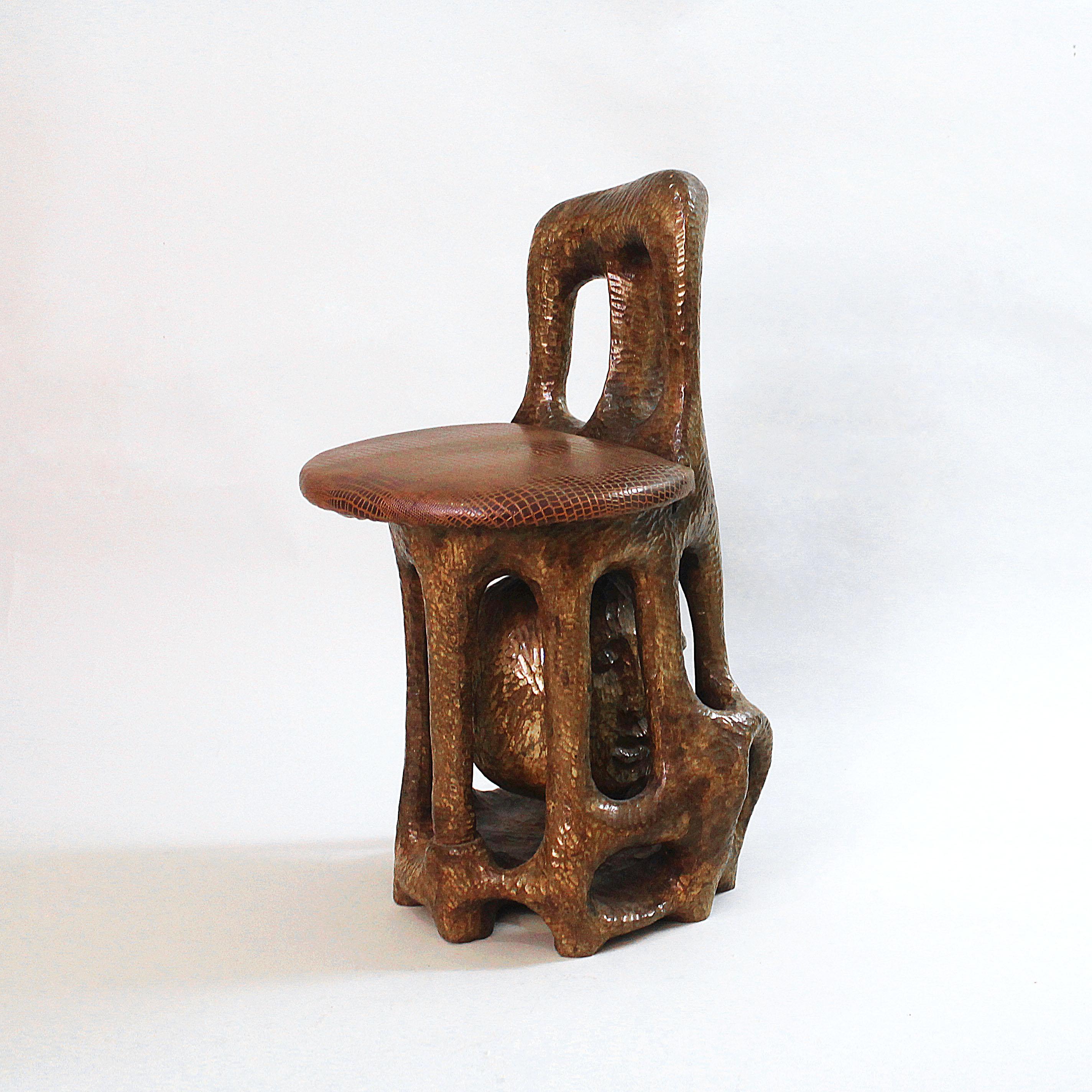 One off, unique Sol Garson sculptural stained wood hand carved chair, signed '74. Seat upholstery is made by Faux Croco leather. Apparently is comfortable. Sol Garson born in 1923 and he lived in the UK where he made his name. This chair is