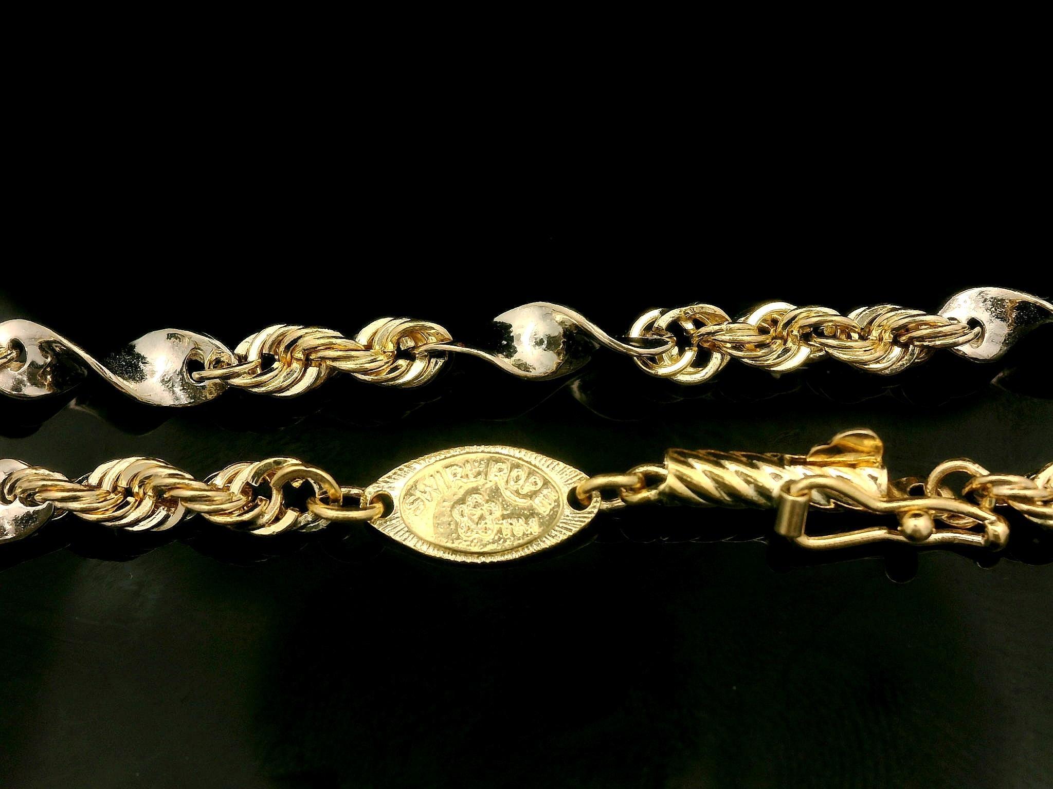 Collier unique en or jaune et blanc 14k avec chaîne à maillons en forme de tourbillon de 16