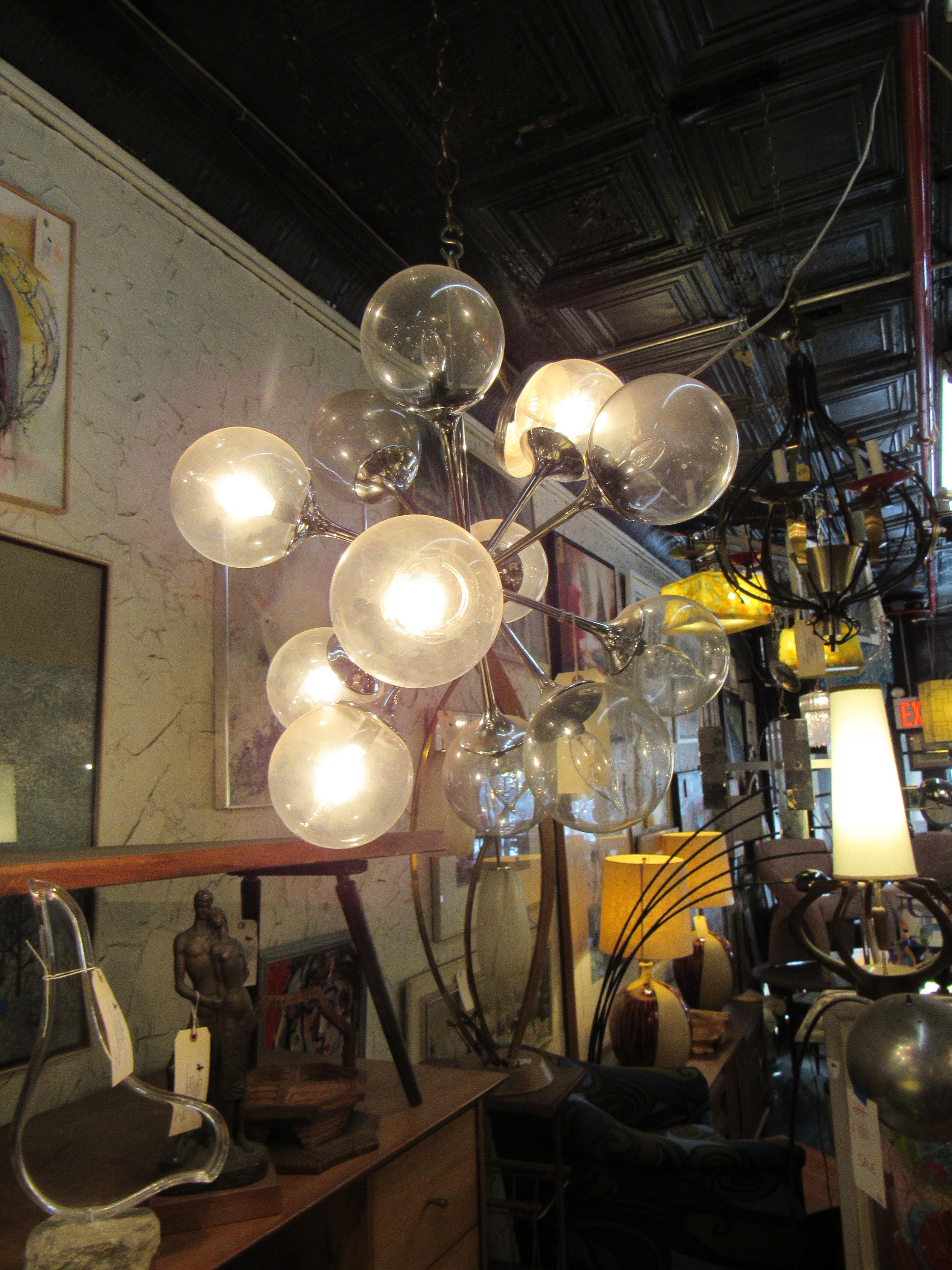 This vintage Sputnik-style chandelier is full of Mid-Century Modern style and is a stylish way to provide lighting in any space. 
Please confirm item location with seller (NY/NJ).