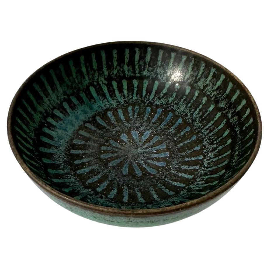 Unique Stig Lindberg bowl, hand-crafted in 1963 at Gustavsberg in Sweden.

Hand-thrown stoneware with a beautiful turquoise blue glaze with impressed pattern.

Marked underneath. Was an anniversary present.

Diameter: 8.5 cm
Height: 3 cm