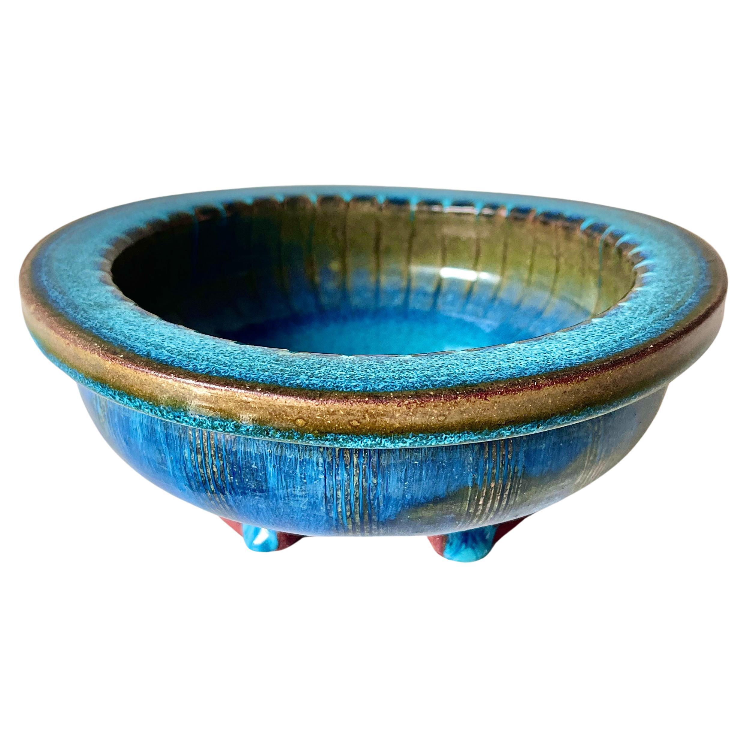 Striking unique stoneware bowl designed by Wilhelm Kåge from the ‘Farsta’ series for Gustavsberg, Sweden, 1952. Vibrant blue hare’s fur glaze with an exposed base creates a dramatic contrast typical for Kåge’s Farsta pieces.

Impressed at the base