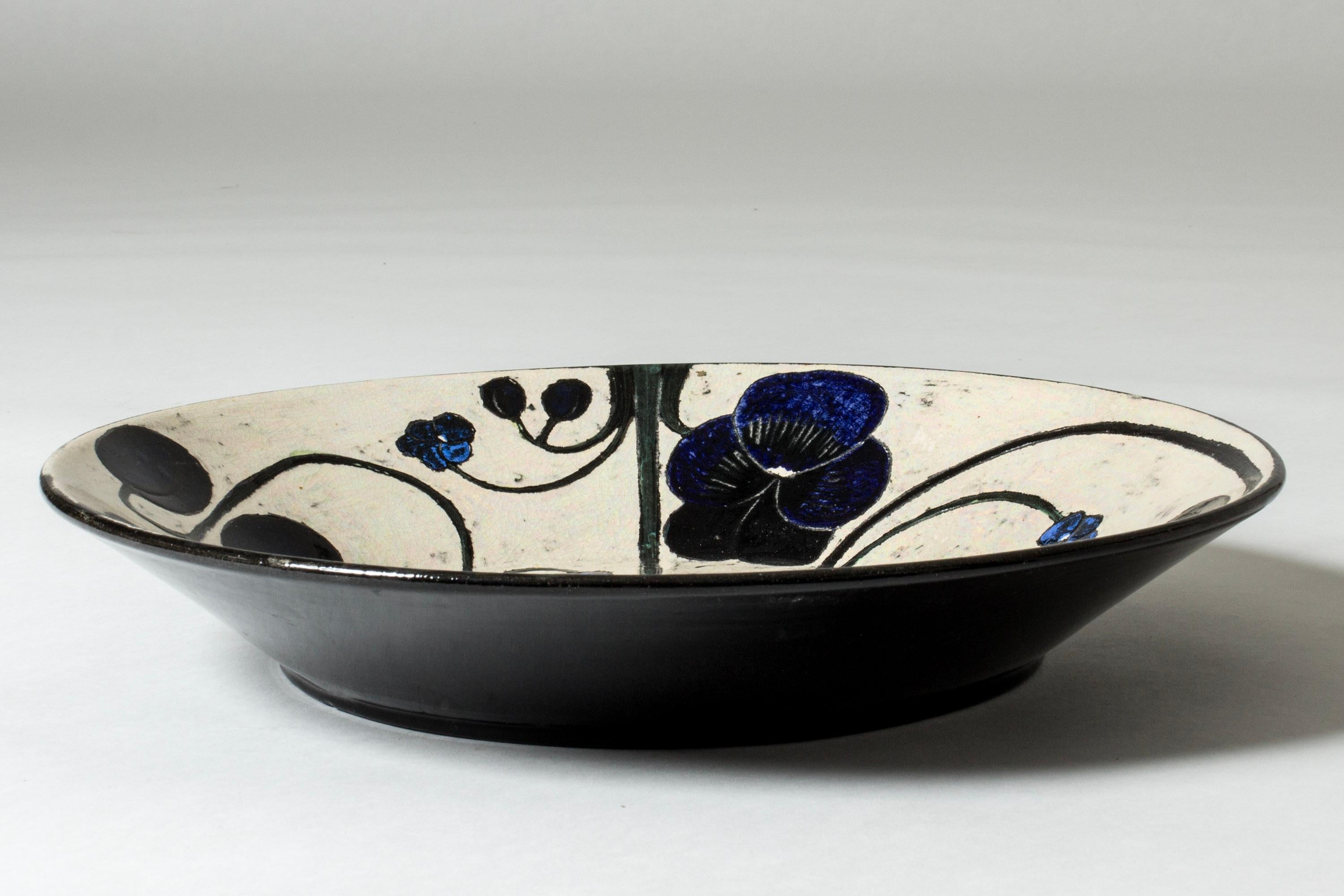 Amazing, unique stoneware platter by Birger Kaipiainen. Beautiful composition on a white background, of a white flower, two silvery pears and violets.

Birger Kaipiainen was Finland’s foremost ceramic artist of the midcentury period, whose unique