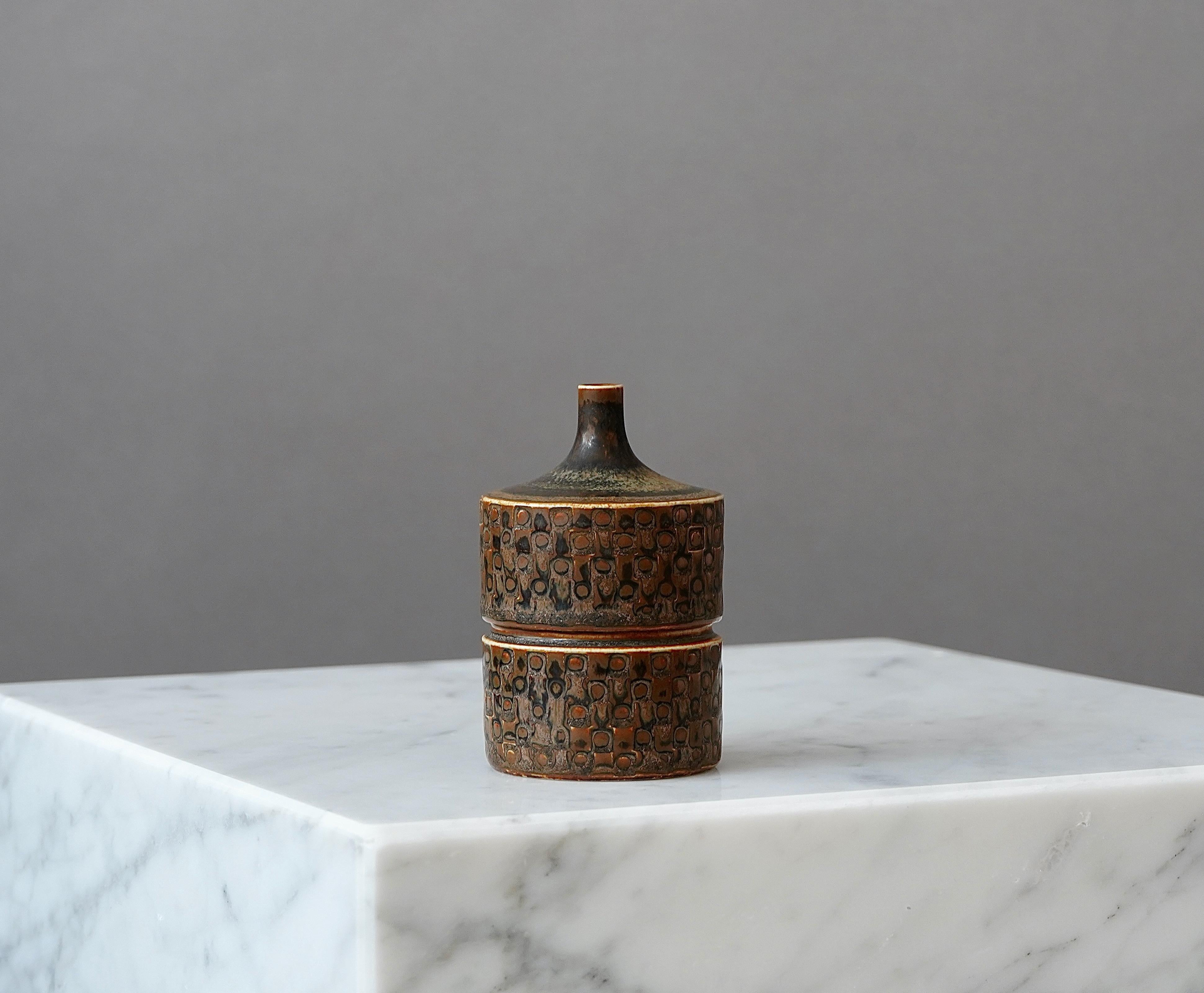 A beautiful and unique stoneware vase with amazing glaze.
Made by Stig Lindberg in Gustavsberg Studio, Sweden. 1962.

Excellent condition.
Incised 