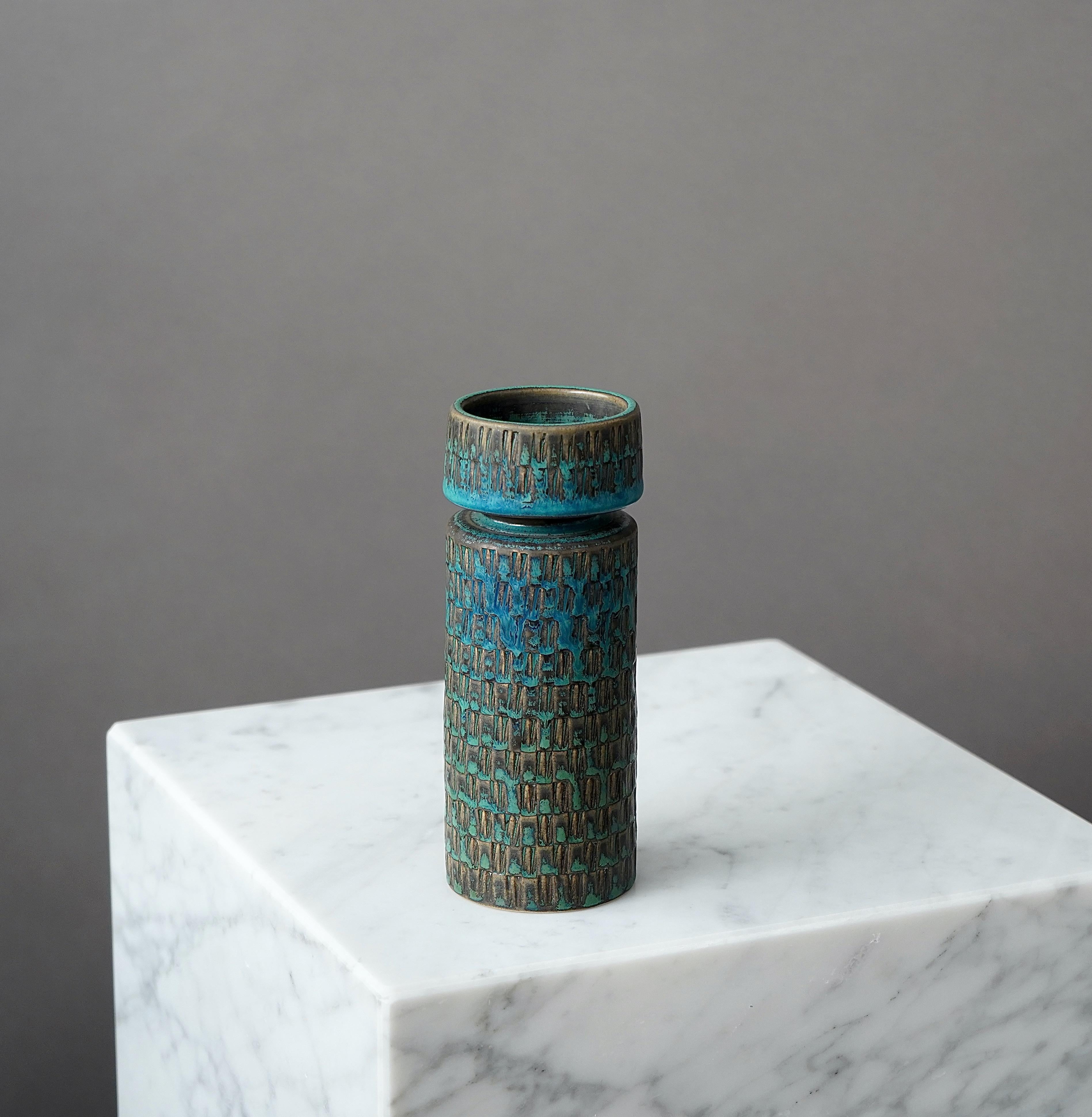 A beautiful and unique stoneware vase with amazing glaze.
Made by Stig Lindberg in Gustavsberg Studio, Sweden, 1962.

Excellent condition.
Incised 