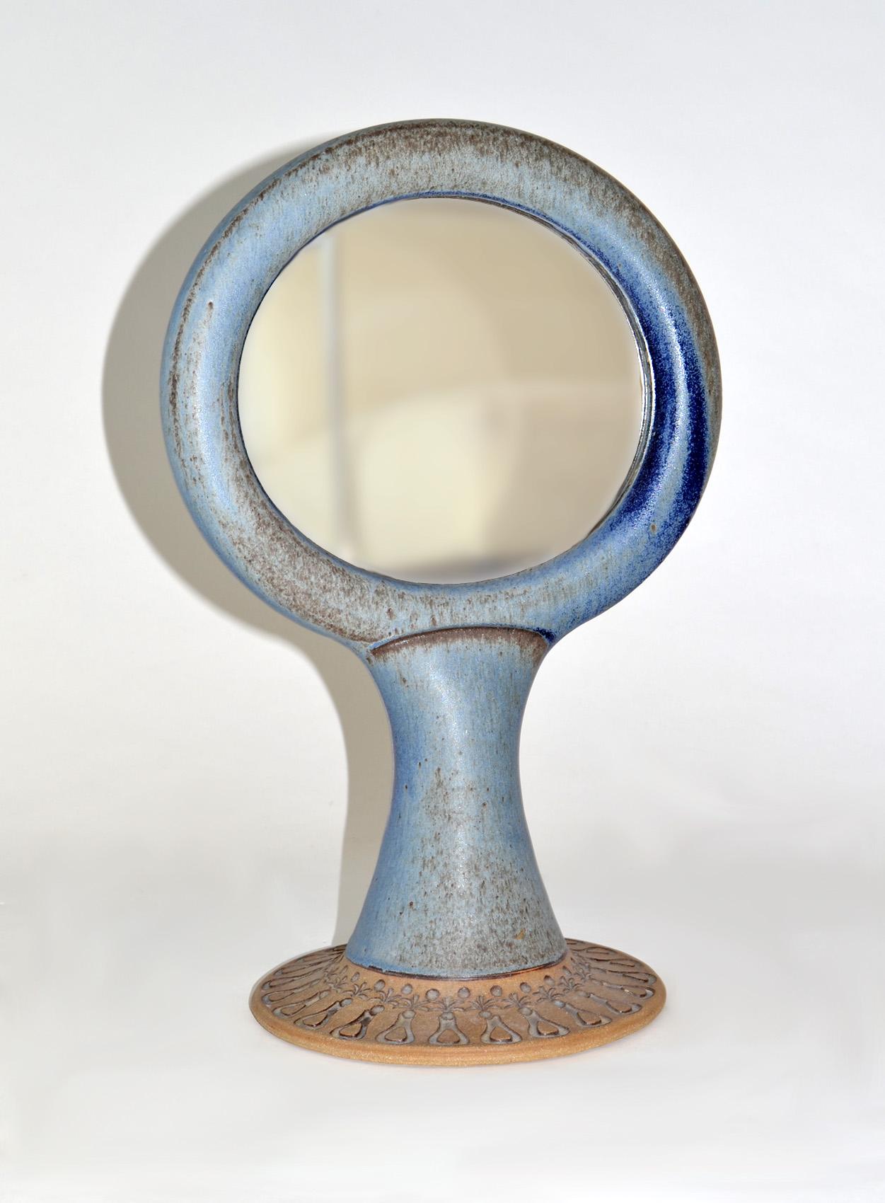 Unique Studio pottery glazed ceramic two sided vanity or table mirror 1960s.
Beautiful blue and brown Swedish-style glazing and incising. Repeating organic design to base. In the style of Stig Carlsson or Gunnar Nylund. 
Possibly a unique example.