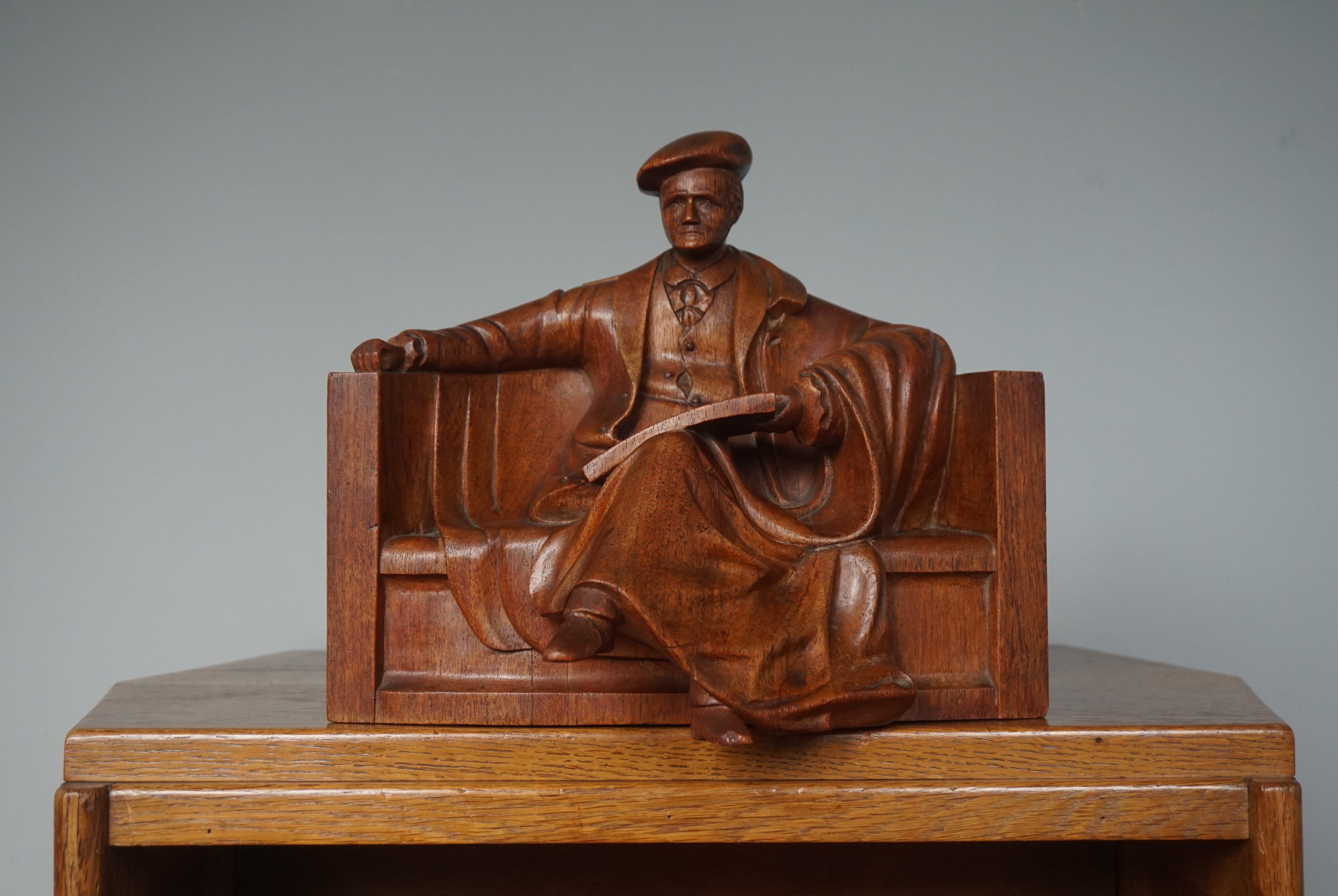 One of a kind sculpture of a well dressed male professor in a rounded chair.

With early 20th century decorative antiques as one of our specialities we were thrilled to find this hand carved sculpture. First of all, because of the subject matter,