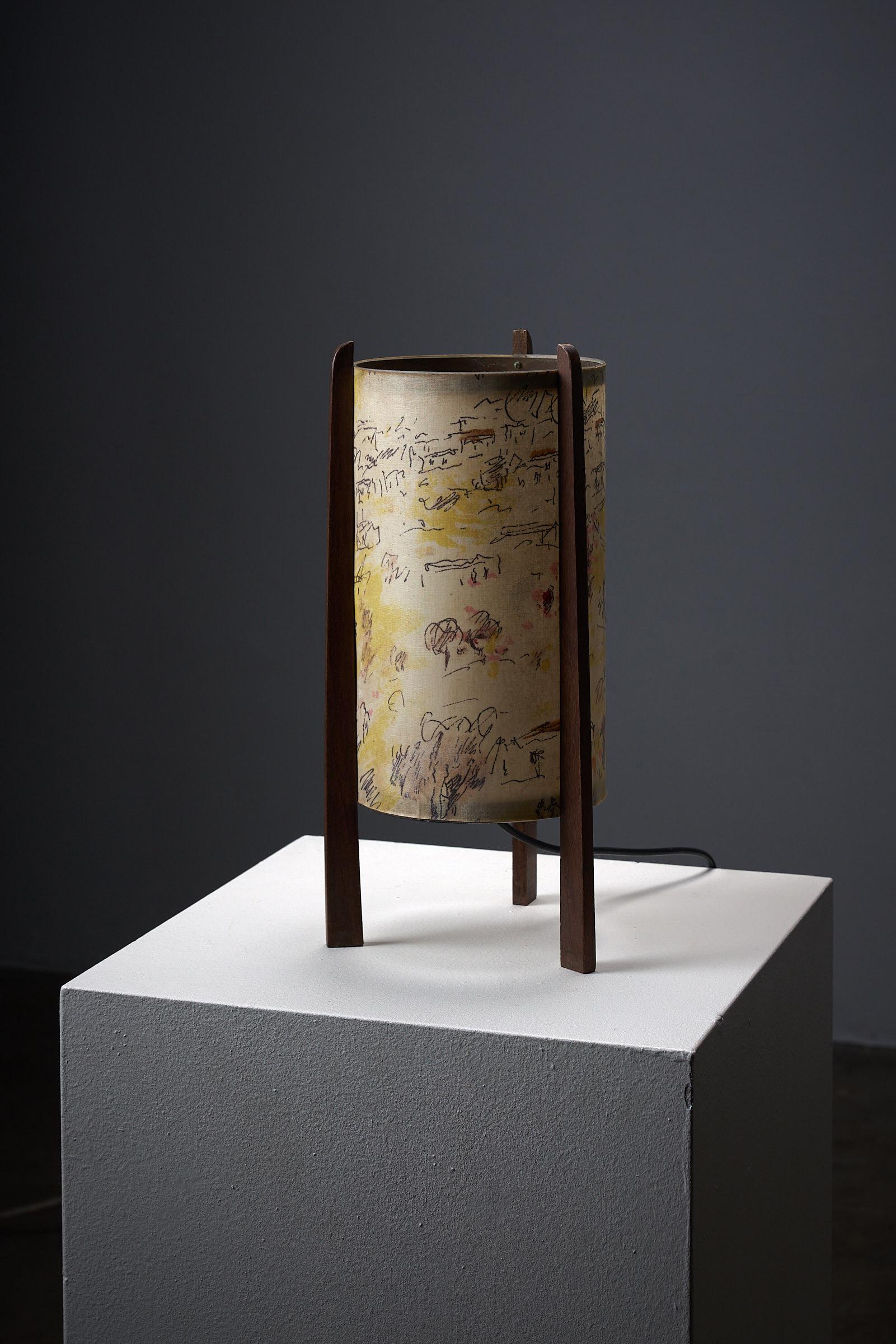 Introducing a one-of-a-kind table lamp by the renowned painter Michele Cascella, a true masterpiece that transcends the boundaries between art and functional design. This unique creation captivates with its simplicity, showcasing a painted shade
