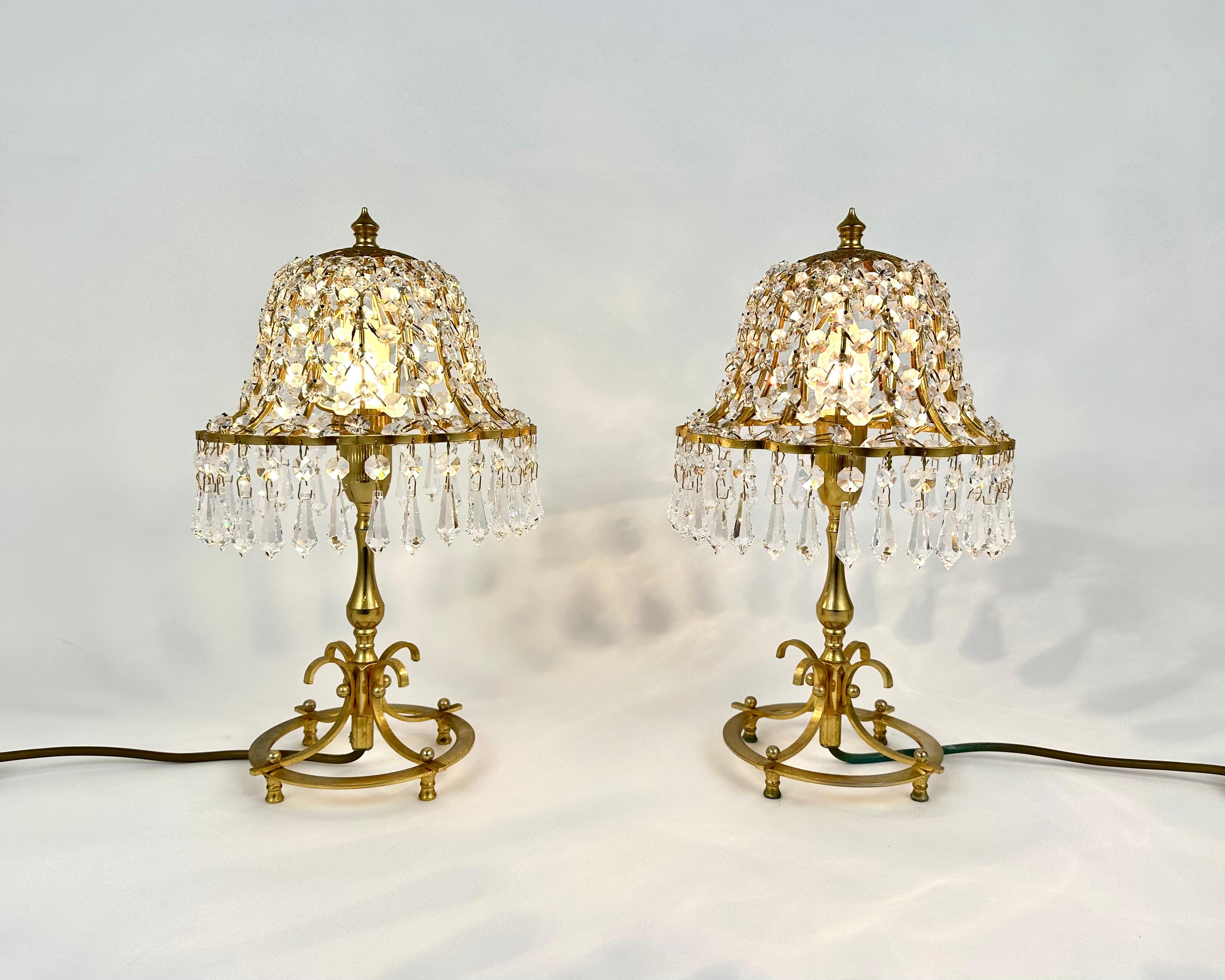 Unique vintage table lamps from France, 1960s.

Beautiful paired table lamps, which have an impressive design off and even when the condition is switched on, a very nice soft light throws through the lead crystals.

It has a very nice 30% lead
