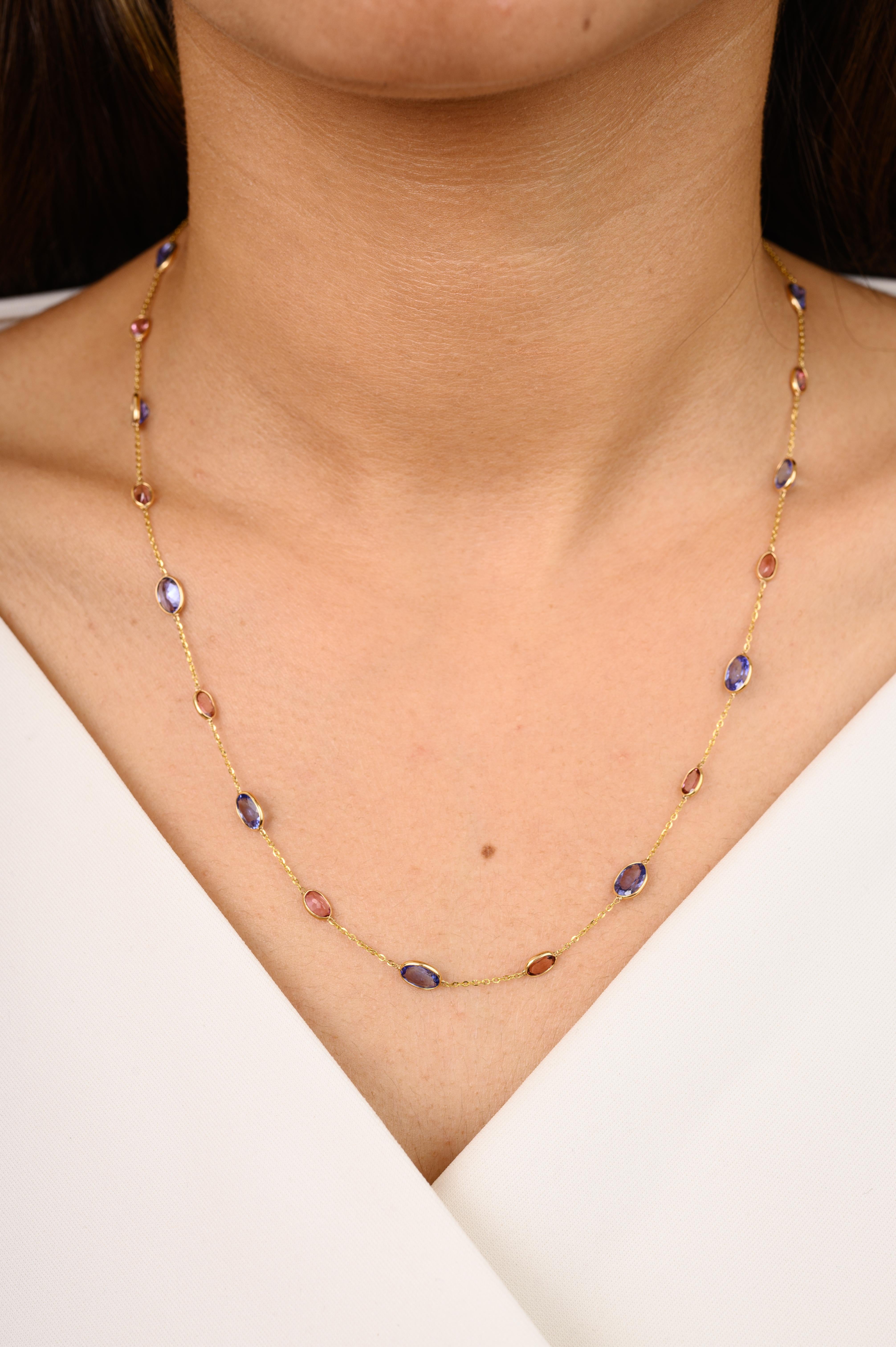 Unique Tanzanite and Tourmaline Station Necklace in 18K Gold studded with oval cut tourmaline and tanzanite. This stunning piece of jewelry instantly elevates a casual look or dressy outfit. 
Tanzanite brings energy, calmness and happiness into life