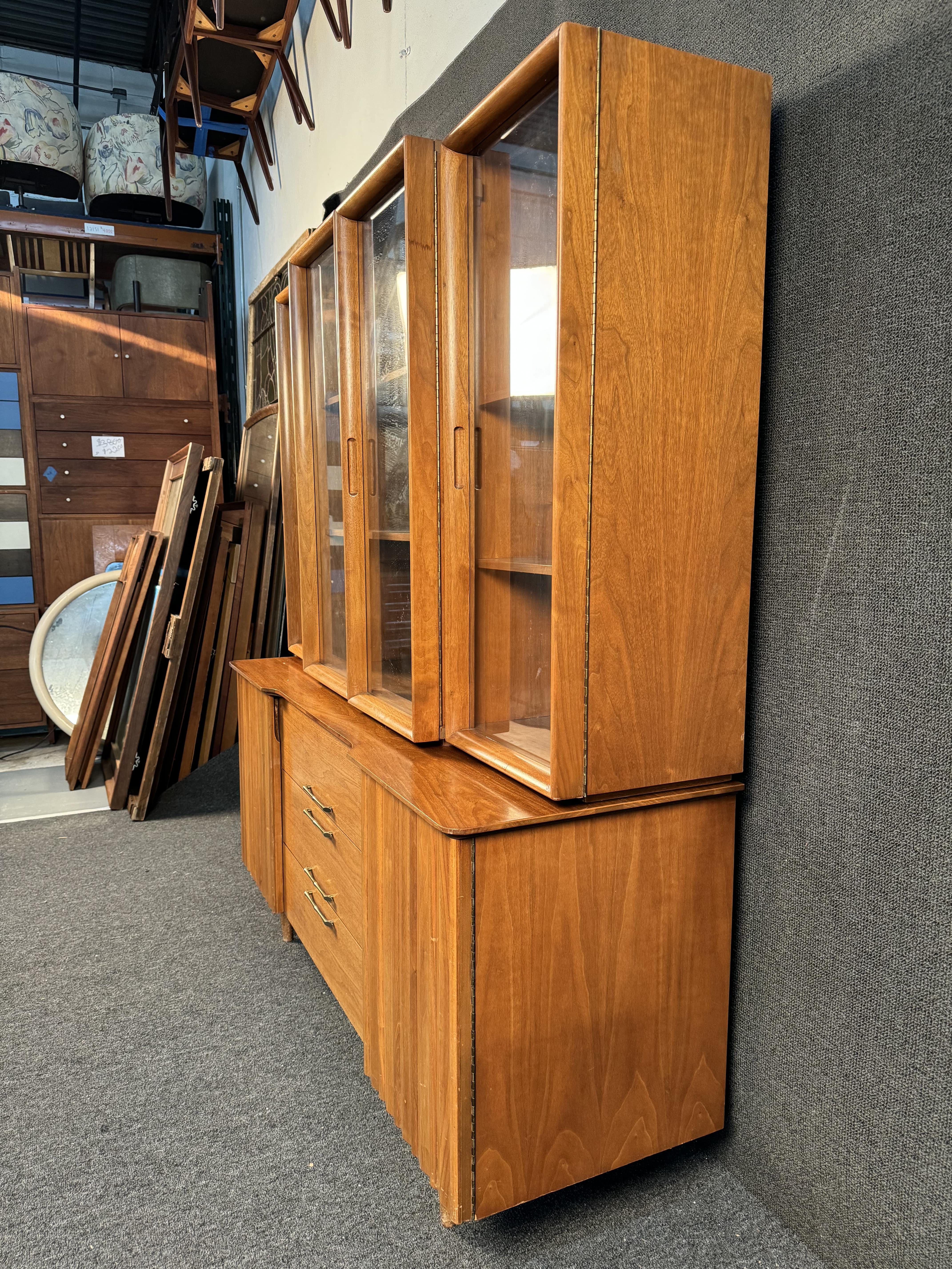Young Manufacturing Mid-Century Walnut Sideboard Credenza Buffet and Hutch. This item features stylish metal door pulls and heaps of storage space. Please confirm item pickup location (BK or NJ) with seller.