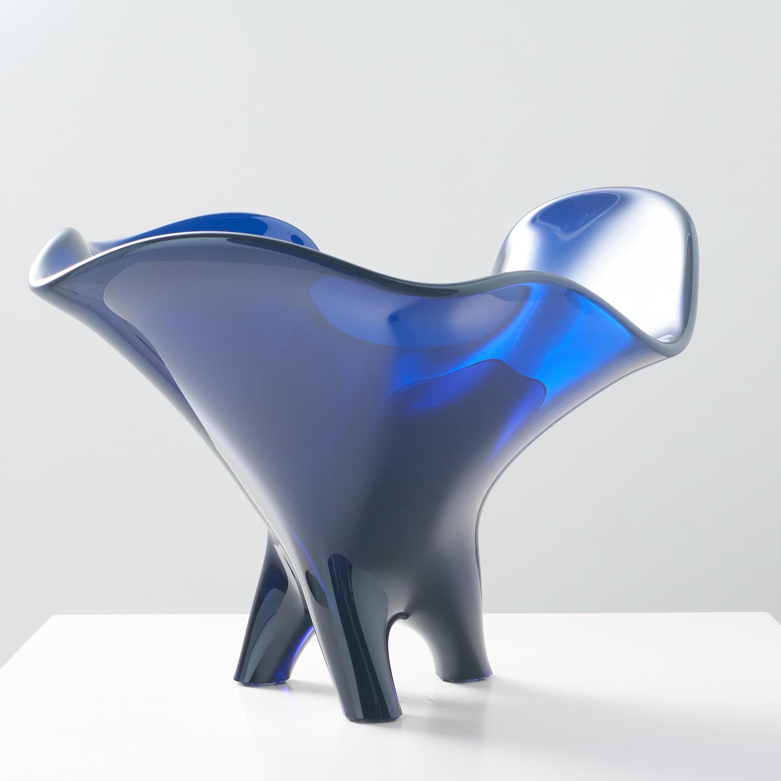 A unique Tornado blue glass bowl with three feet by Allan Scharff for Holmegaard Glass.
