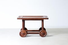 Unique trolley in oak with tray top and large wheels.