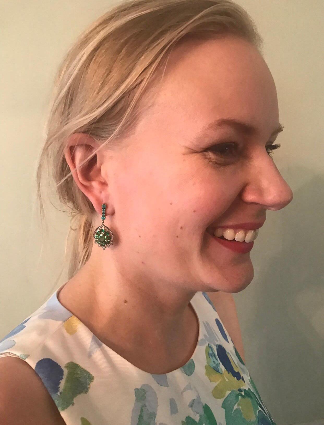The Bespoke Green Garnet, (Tsavorite) Oval Center stones Are over 2 CT's Each, Which makes these Earrings Quite Unique, Surrounded By Smaller Oval Shape Tsavorites, Accented With Colorless Diamonds And Brazilian Paraiba Tourmalines. Color
