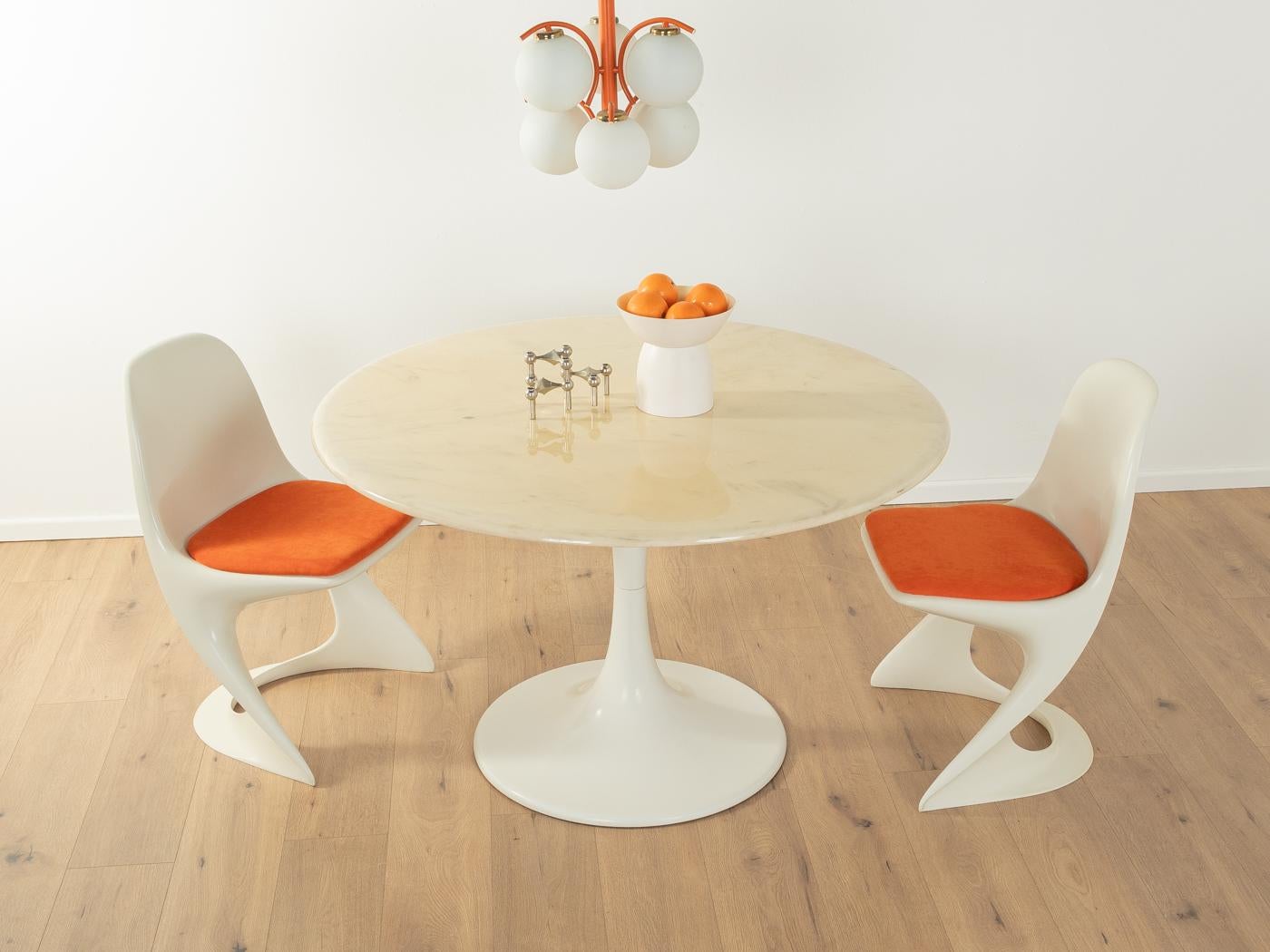 Unique Tulip dining table from the 1960s. Marble table top in cream white with an aluminium base in white.

Quality Features:

    accomplished design: perfect proportions and visible attention to detail
    high-quality workmanship using