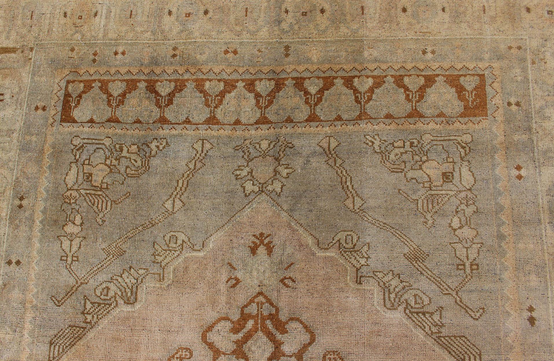 Mid-20th Century Unique Turkish Oushak Rug with Muted Colors in Taupe, Gray, Ice Blue and L.Green For Sale