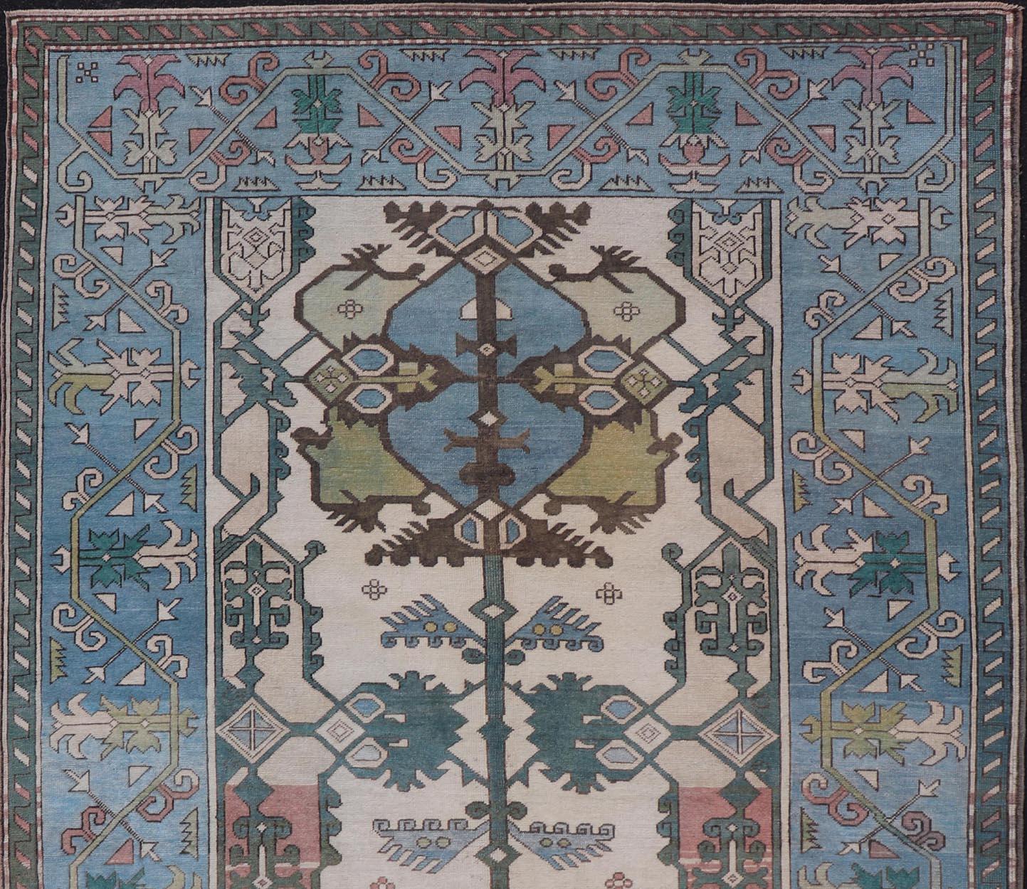 Wool Unique Turkish Rug with Bold Florals in Lt, blue, Lt, Green, Teal & Pink  For Sale