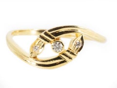 Unique Twist Design Ring made from 18K Yellow Gold with 0.05 Natural Diamonds
