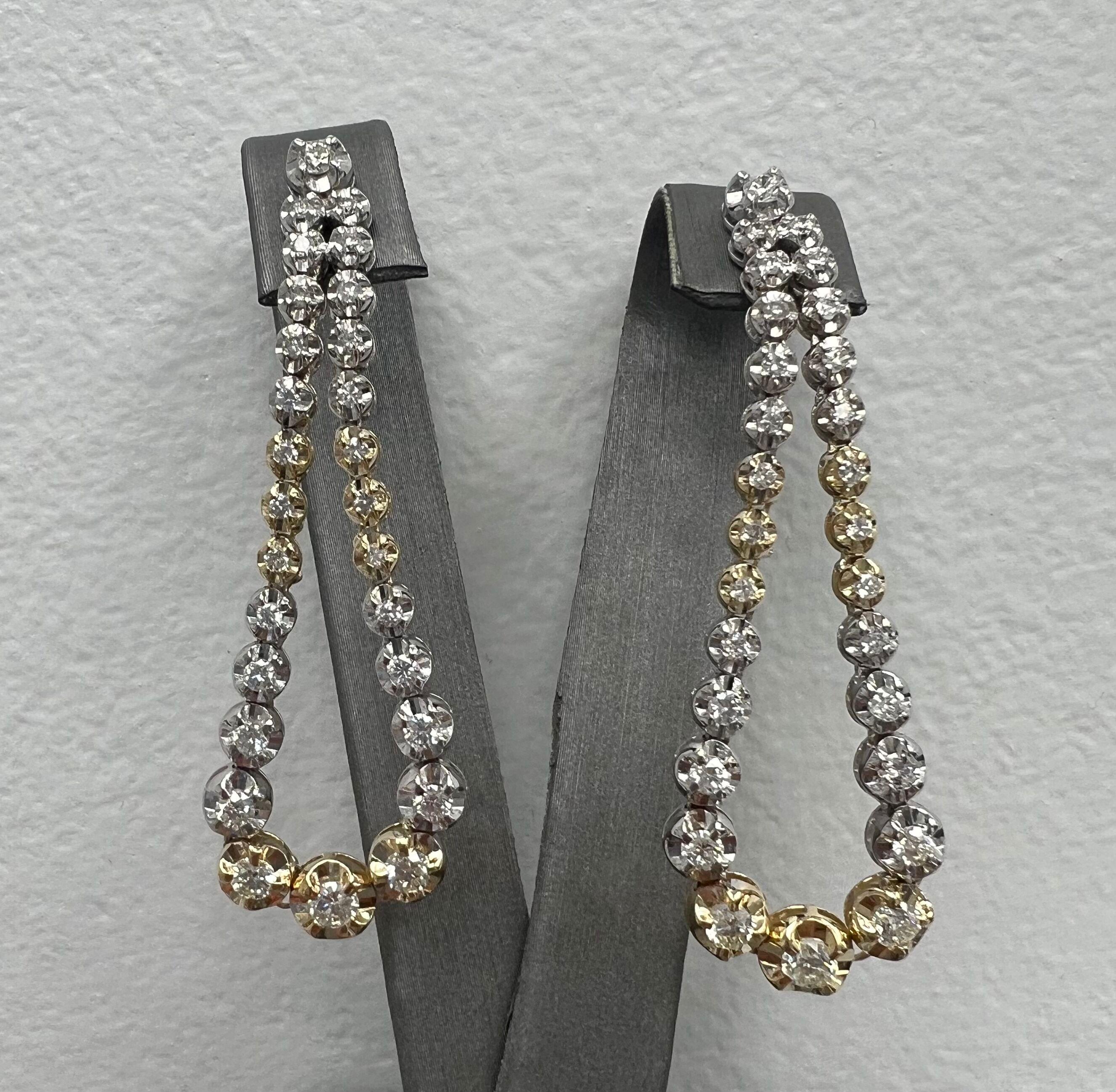 Unique Two Tone 18k Drop Earrings with Natural Full Cut Diamonds.
Amazing new style diamond Earrings perfect for any important occasion.
The Illusion setting makes the diamonds look 10x bigger.
18k White and Yellow Gold
Number of Diamonds: 56
Total