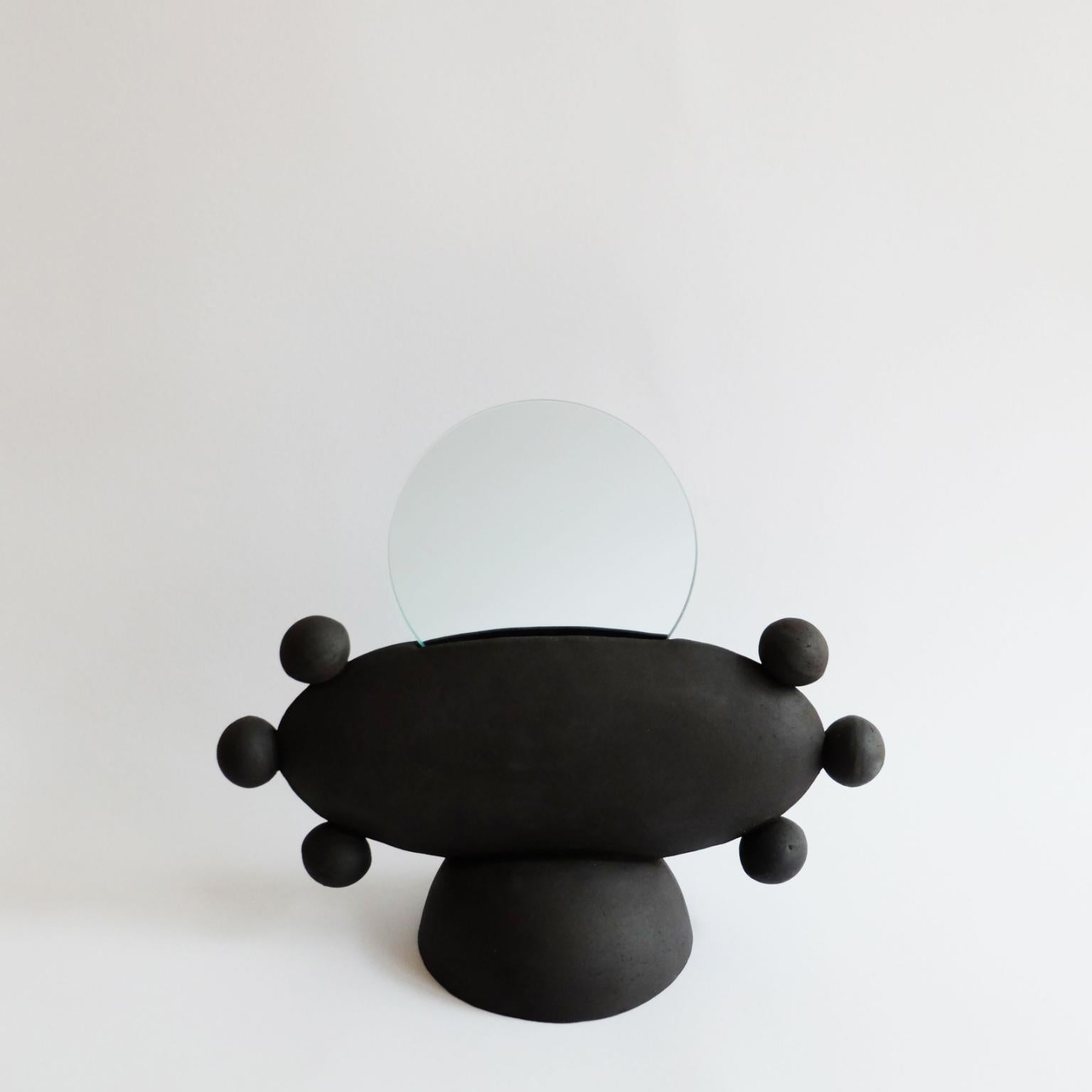 Unique UFO mirror by Ia Kutateladze
Dimensions: W 33 x H 26 cm
Materials: Clay

UFO 02 is a hand built ceramic mirror. Playful and bold functional decorative object, for various types of interiors.

IAAI / Ia Kutateladze is a Georgian