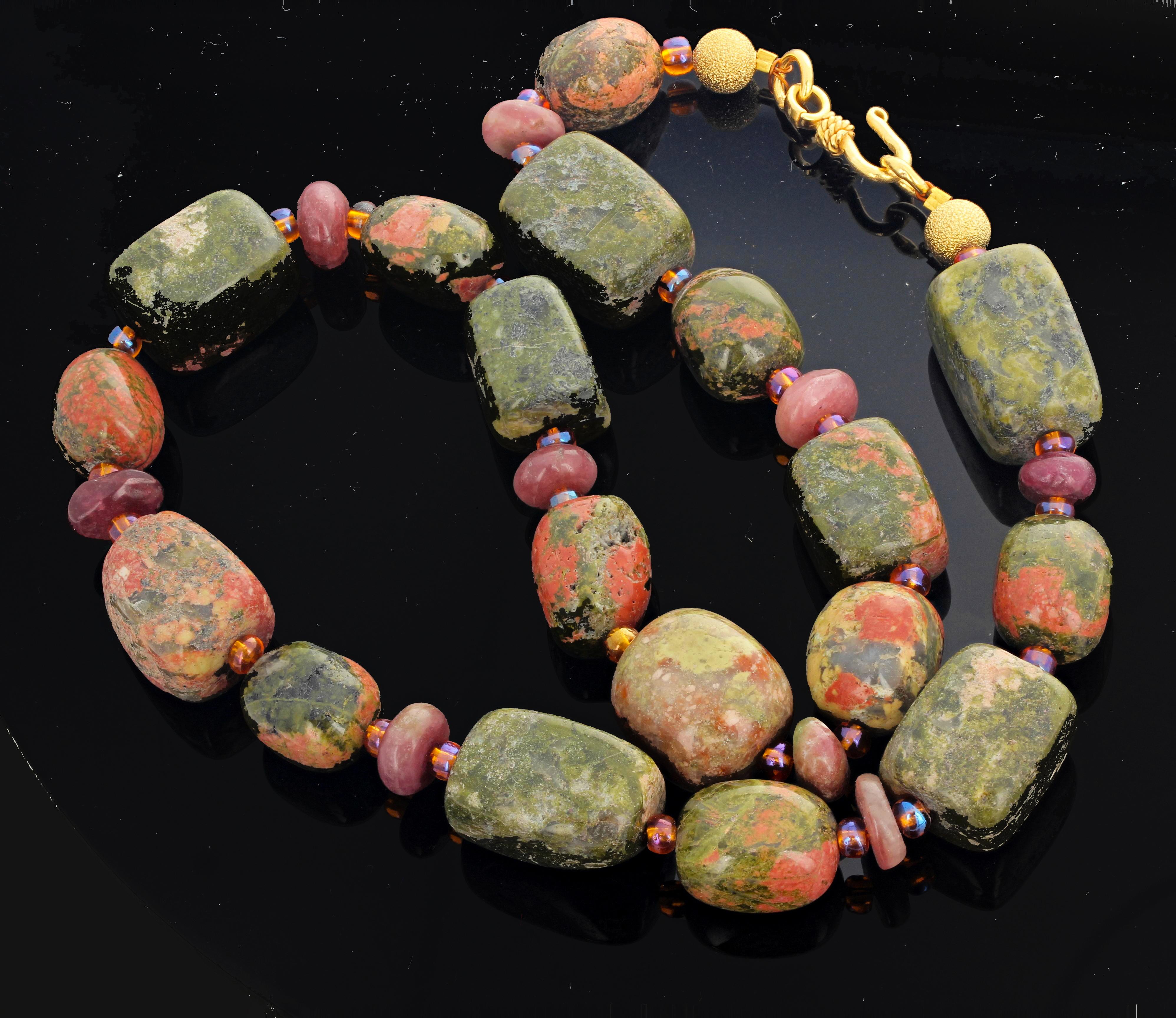 Highly polished glowing Unakite Jasper enhanced with polished rondels of pnky Tourmaline sits elegantly on your neck with an easy to use hook clasp.  The necklace is 20.5 inches long and the largest Jasper is approximately 20 mm x 15 mm.  Unakite