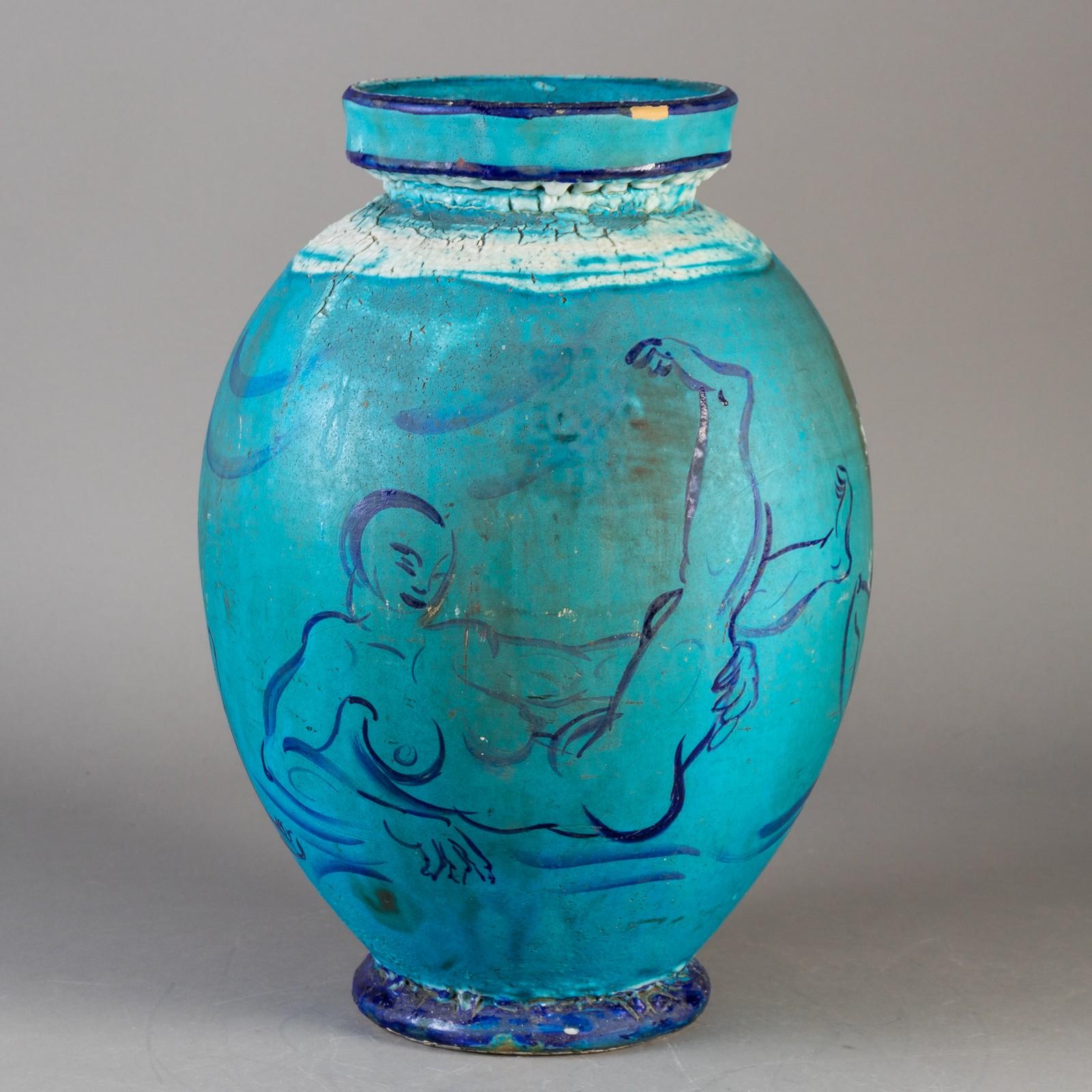 This unique piece of Kahler pottery is an experimental item made by Helge Daner Jensen who worked at Kahler Keramik in Naesvedt, Denmark 1918-1937 
It has figural decoration and a rich turquoise glaze.
      