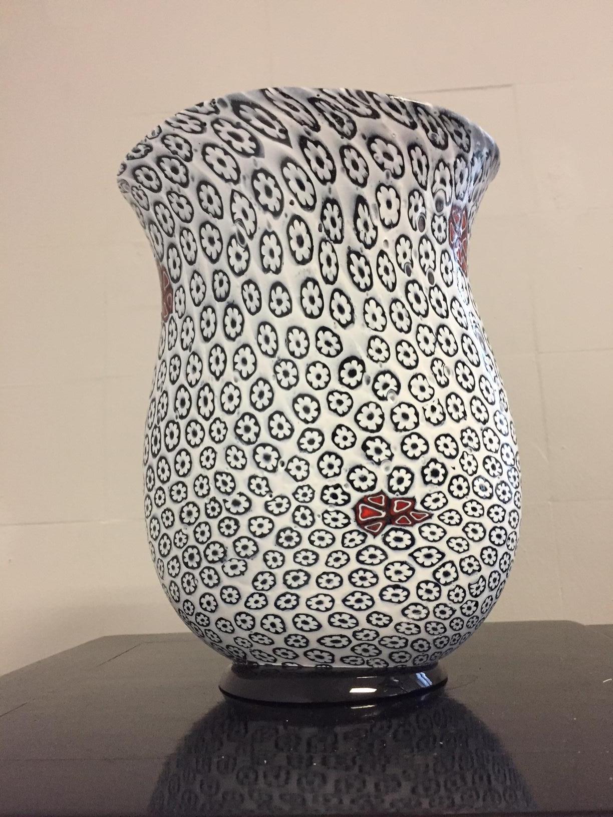 Unique vase in floral pattern, color white and black with random red, rust blossoms has highlights, organic oval shape. Measures: H 30 cm x 23 cm, Signed Tino Rossi 1/1 at the bottom plate
Perfect condition,
Former Owner Guenter Netzer, Footballer.
