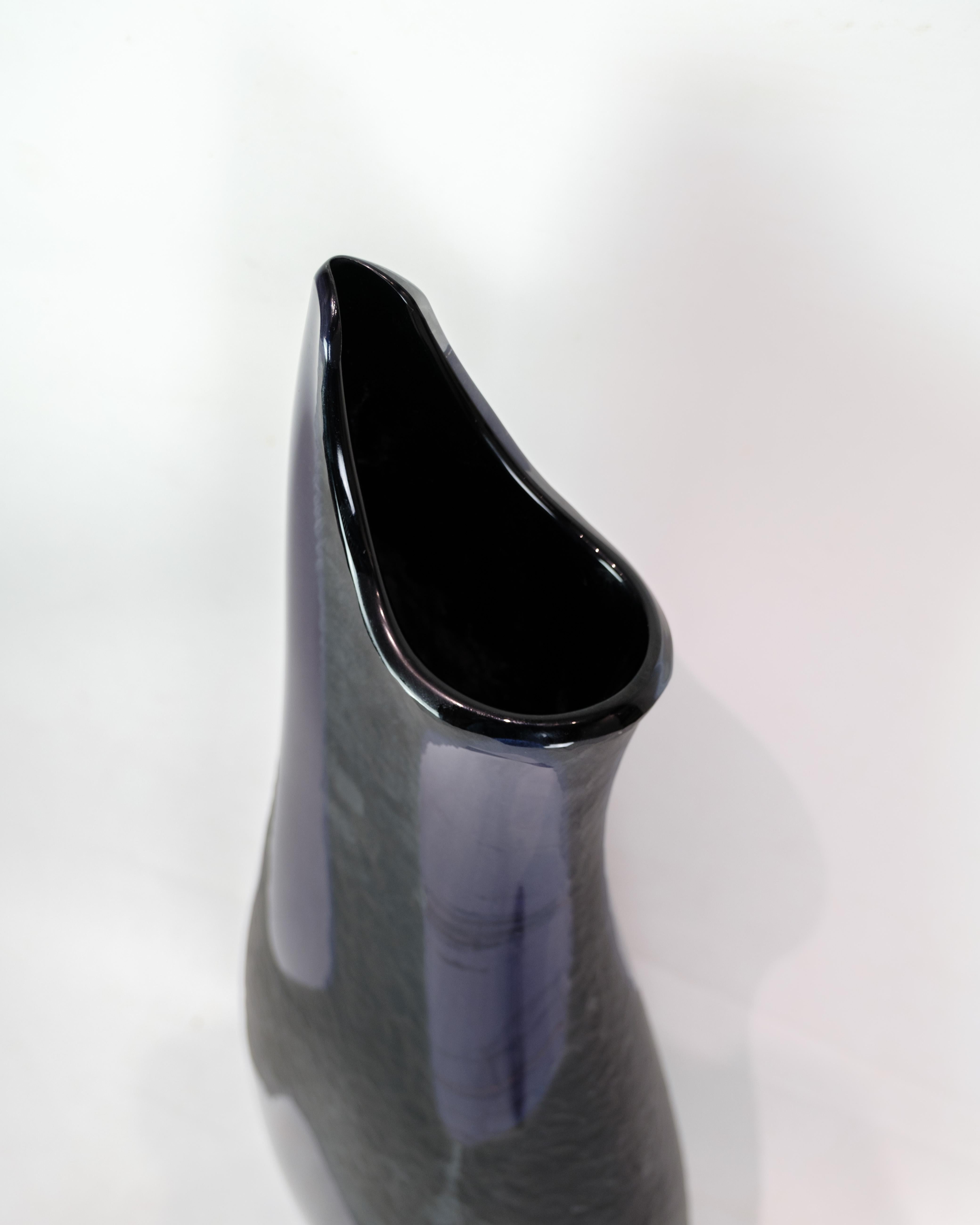 Unique vase designed by Elio Raffaeli in 2018 at Murano, known for his glass works. The vase, which is in dark purple, shows Raffaeli's masterful ability to work with colors and shapes in glass, making it a unique collector's item.

Elio Raffaeli