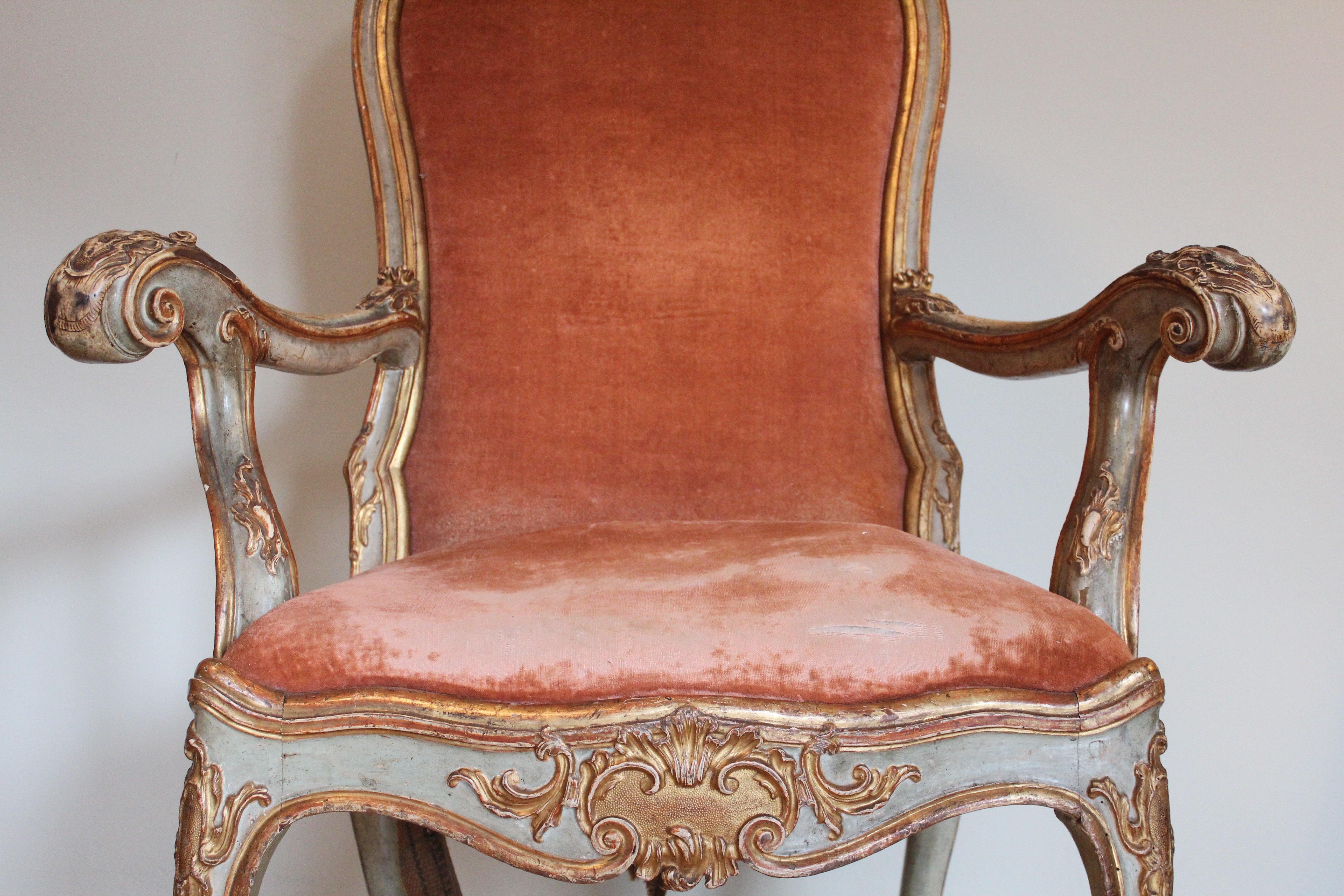 Unique Venetian doge chair. Very large and impressive and monumental piece from an aristocratic provenance. The chair is made of wood, painted with original gold ornaments and rich carvings. Very large backrest, King size and similar to a coronation