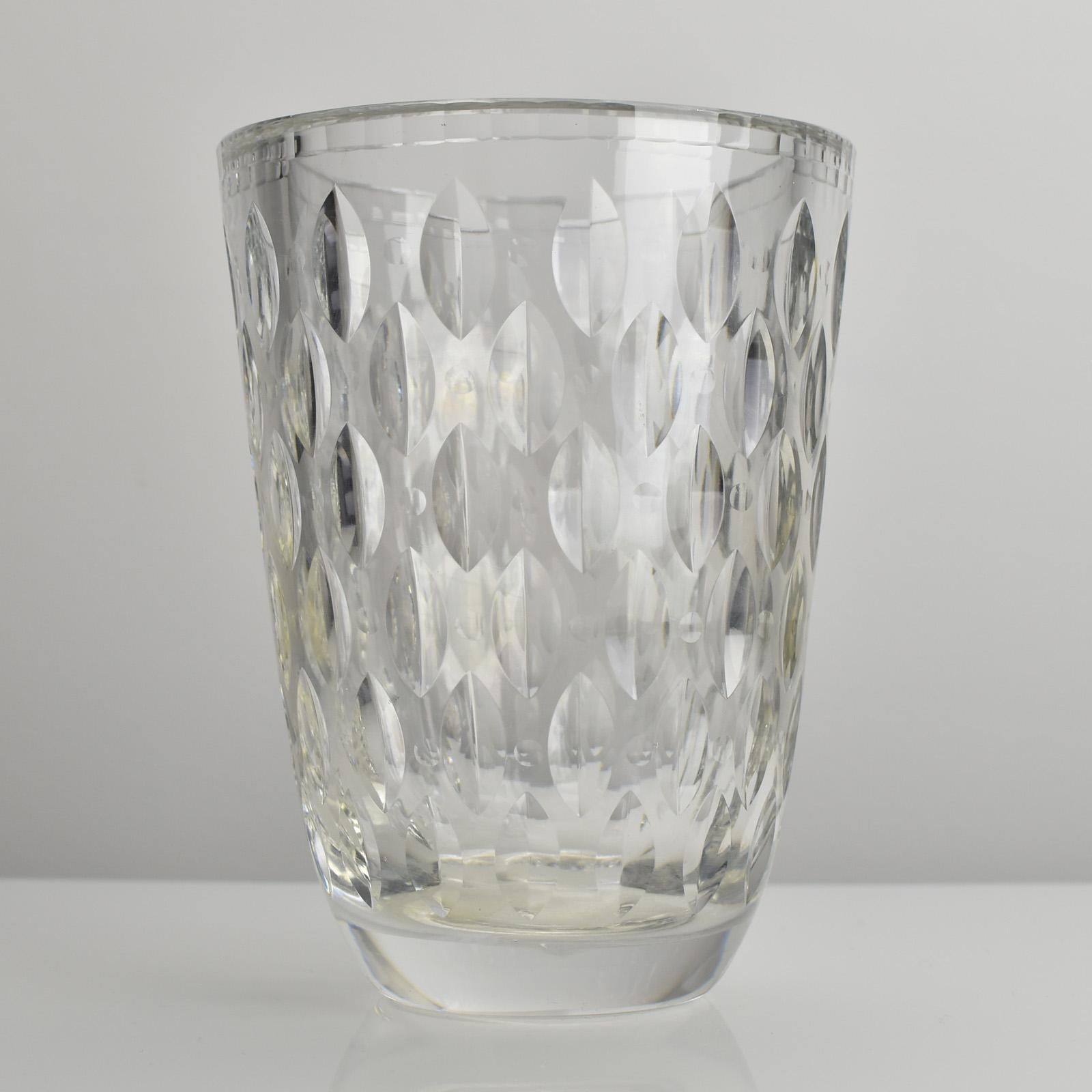 This ultra-rare and striking crystal vase, designed by renowned Swedish artist Vicke Lindstrand for Orrefors, exemplifies exceptional craftsmanship and artistic flair. Likely dating from the early 1940s, this piece showcases an intricate cut pattern