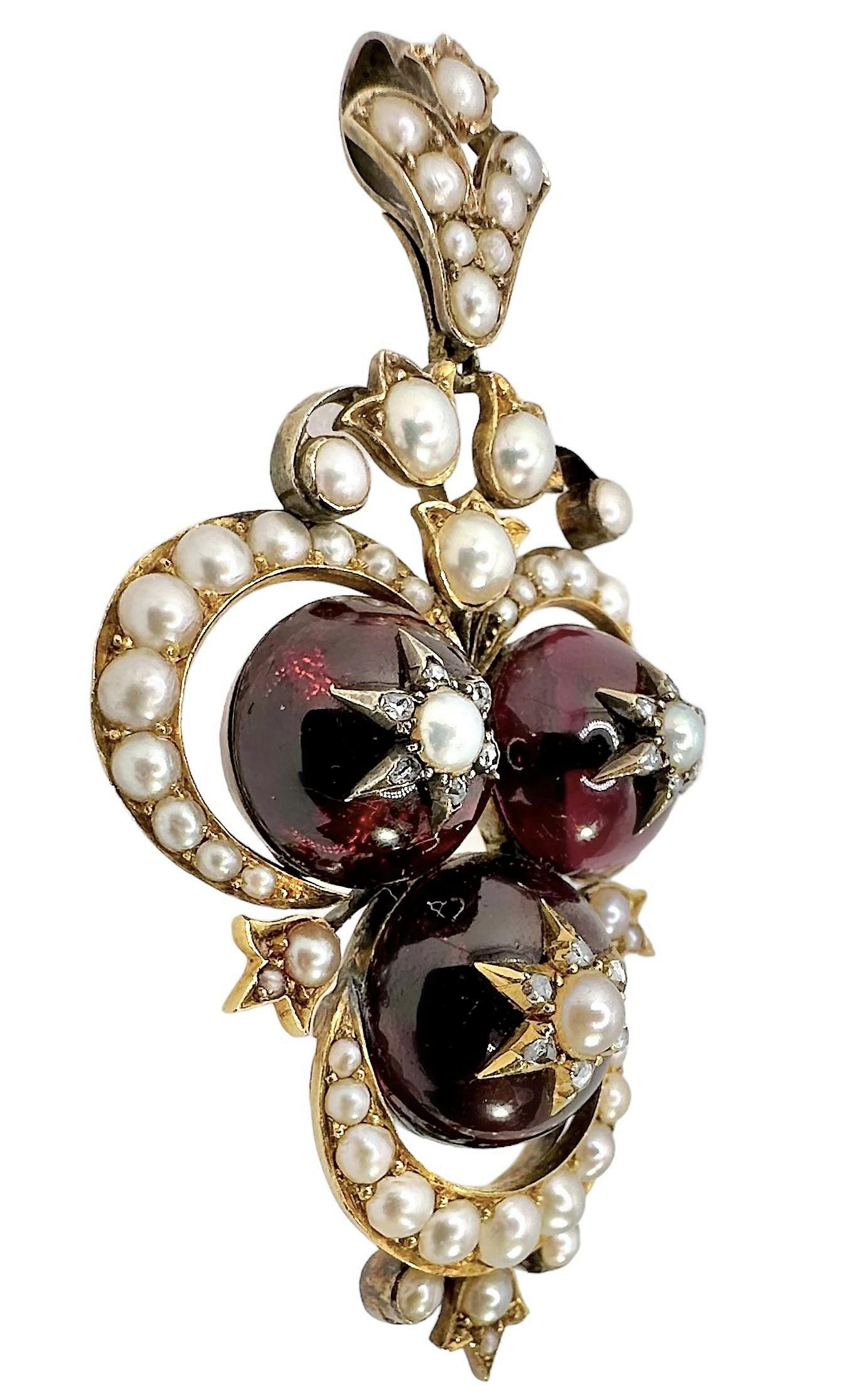This unique Late-19th Century, Victorian period 18k gold, pendant is beautifully crafted with carbuncle and half pearls. With a total height from the very bottom to the top of the bale of 2.75 inches, and a width of 1.5 inches, it is impossible to