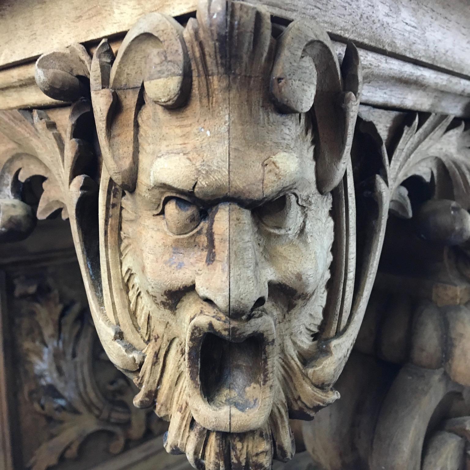 We think this is an apprentice piece due to the variety of carving techniques. The original finish has been stripped to lighten the overall effect and showcase the carved faces at the corner of the tabletop, as well as the lion faces with paws on