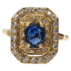 Unique vintage 18k gold ring with an oval sapphire and diamonds, France.