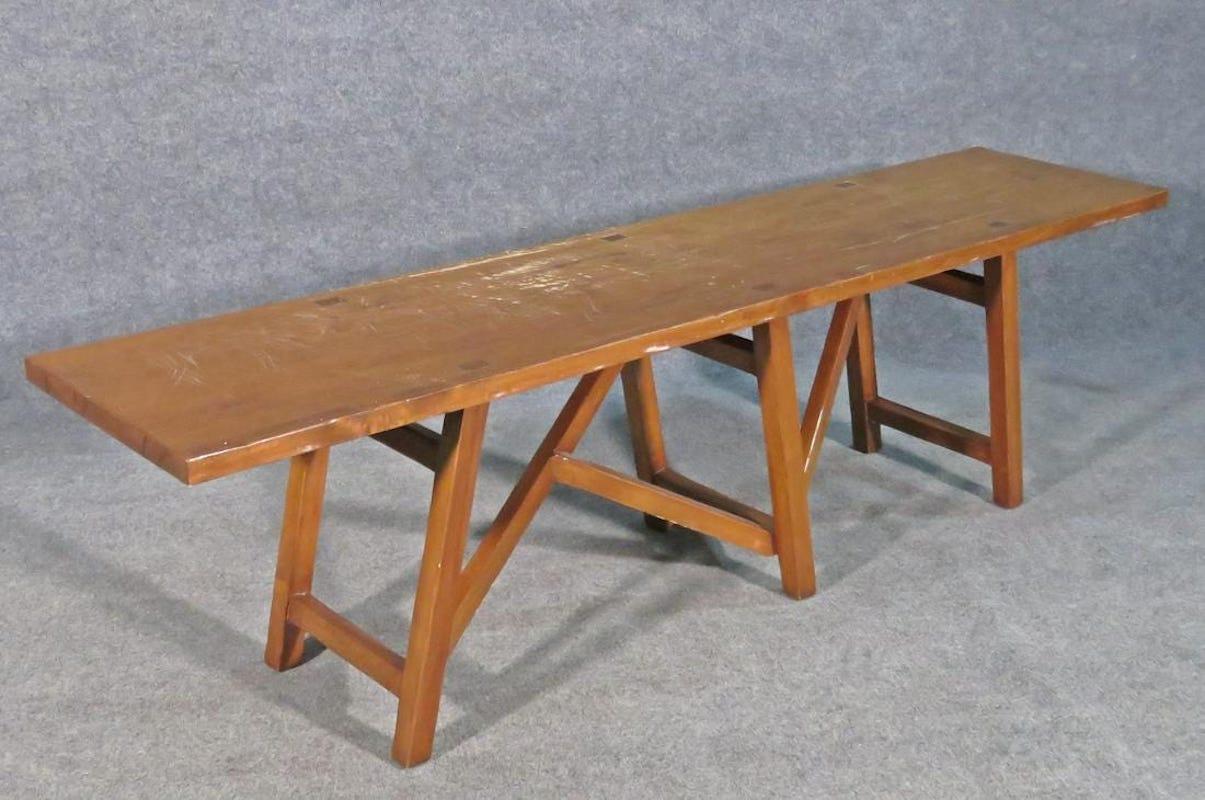 An interesting vintage bench with angled legs forming a unique base. Please confirm item location with seller (NY/NJ).